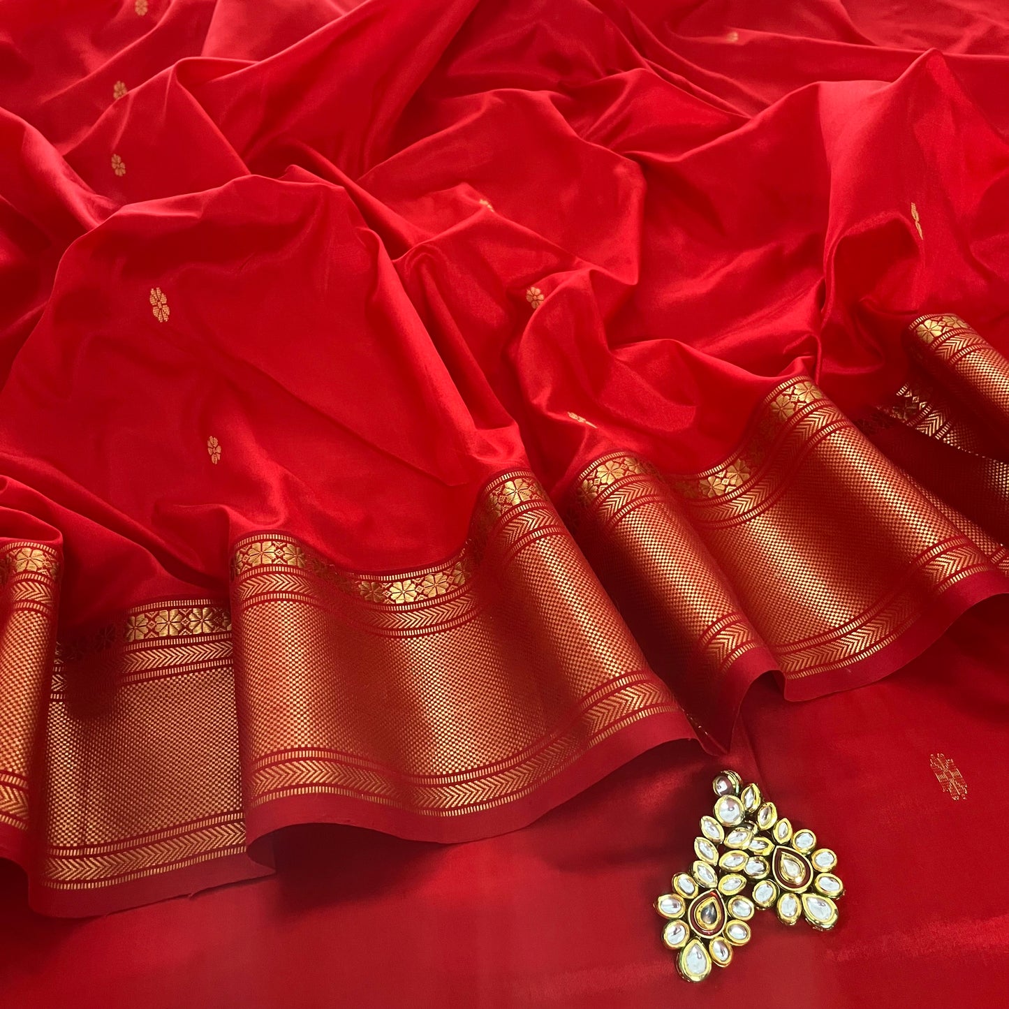 Deep Red Maheshwari silk saree with flower bootis all over