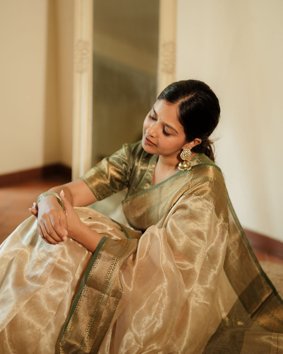 Cream Gold and green Maheshwari tissue silk saree with zari pattern on pallu