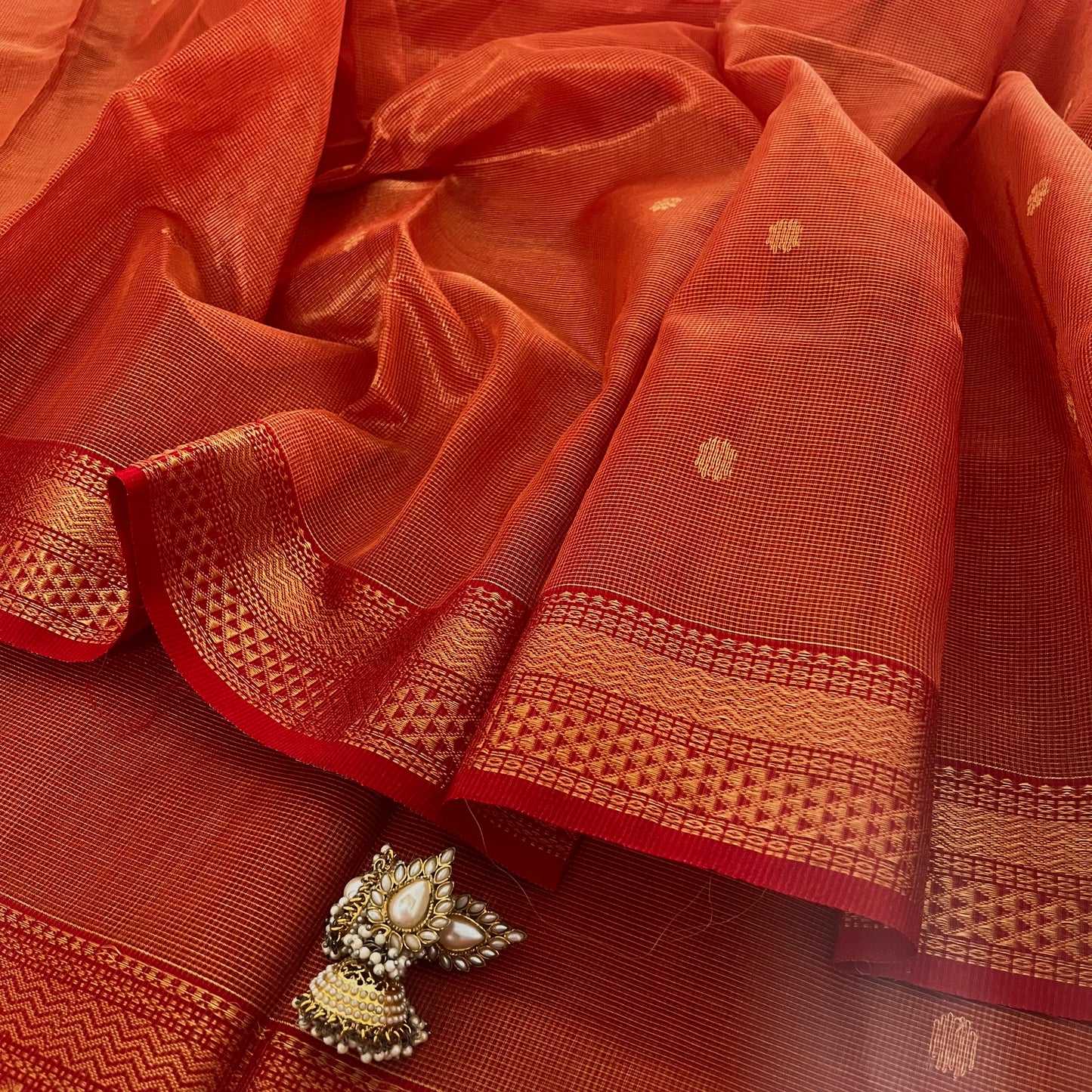 Red and gold Maheshwari silk saree with zari jaal work on pallu