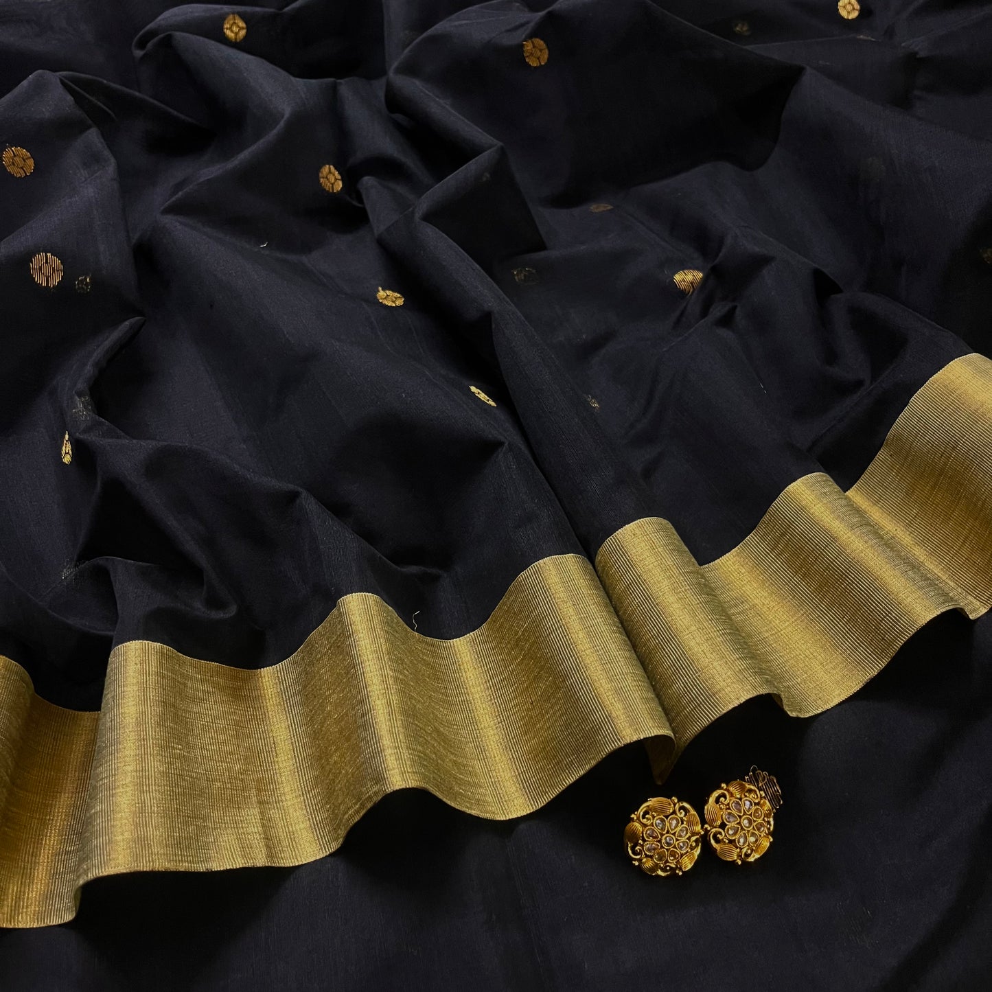 Black Chanderi saree with zari bootis all over and flower motifs on pallu