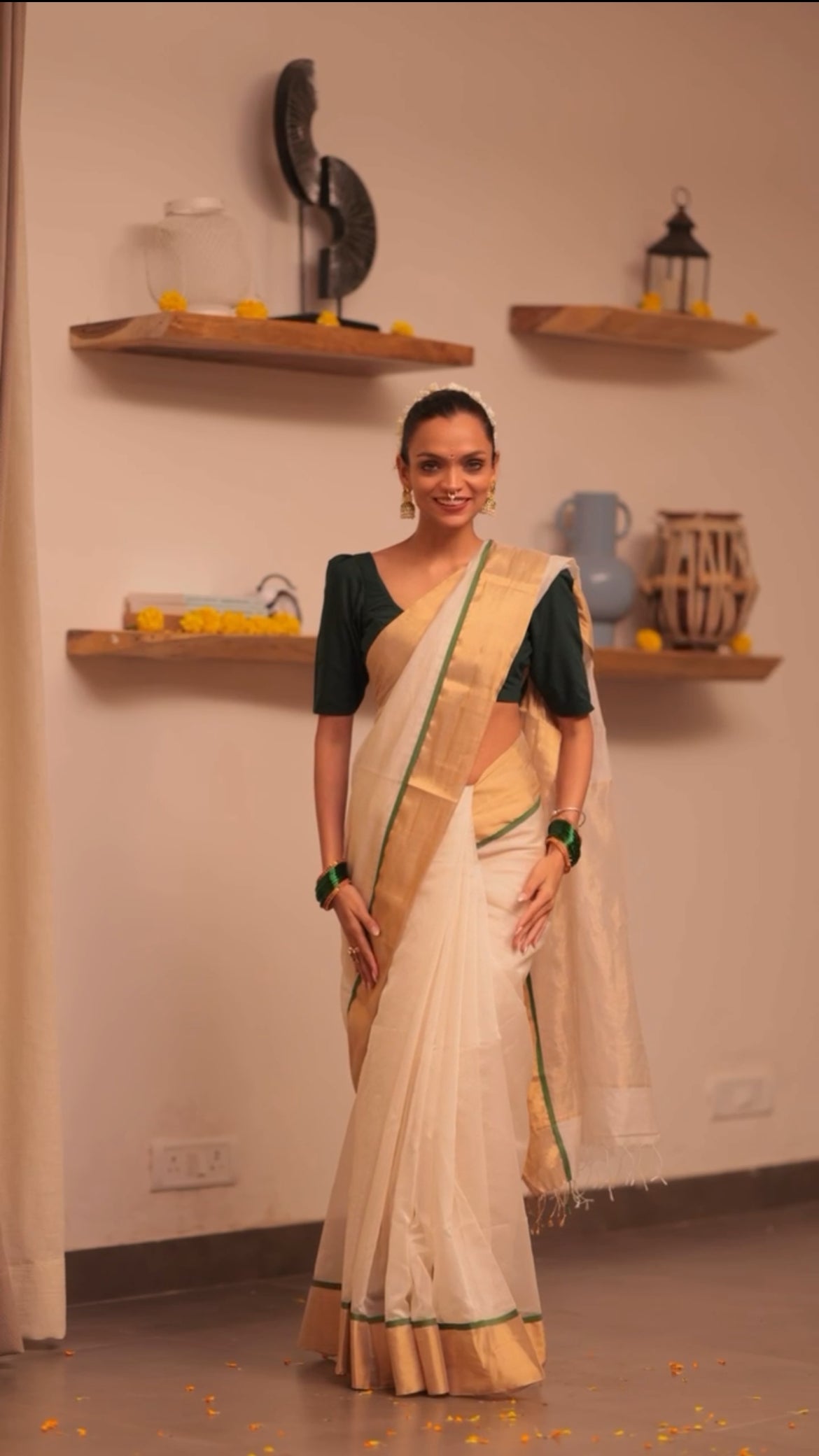 Off white and green maheshwari saree with zari lines on pallu