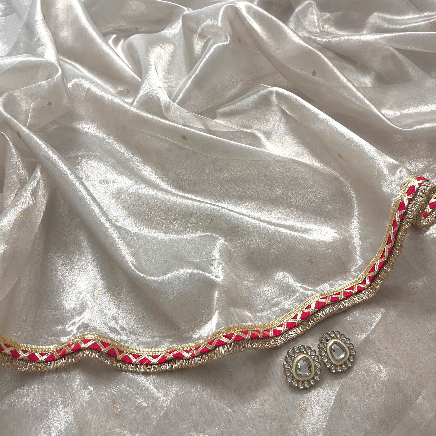 Off white and red Chanderi tissue silk saree with zari bootis all over