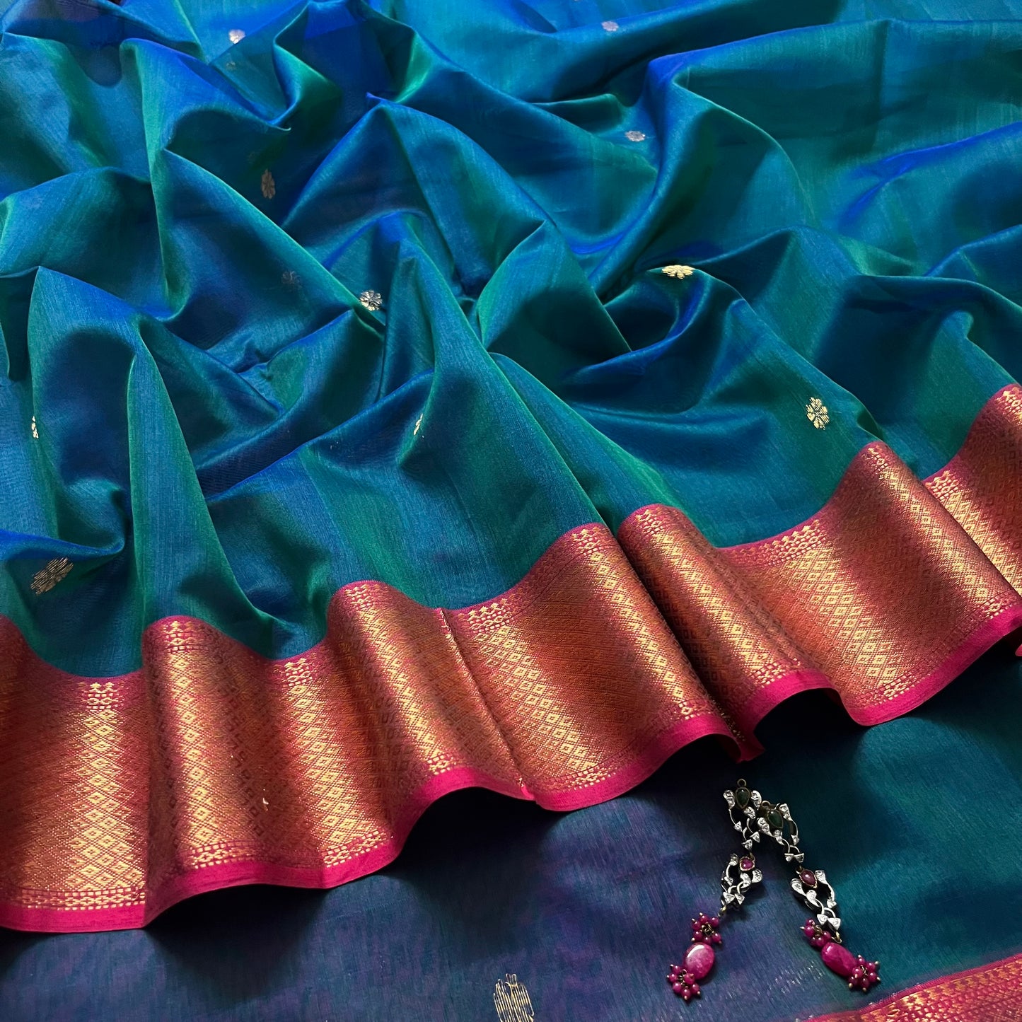 Peacock and Violet dual tone Maheshwari saree with flower motifs on pallu