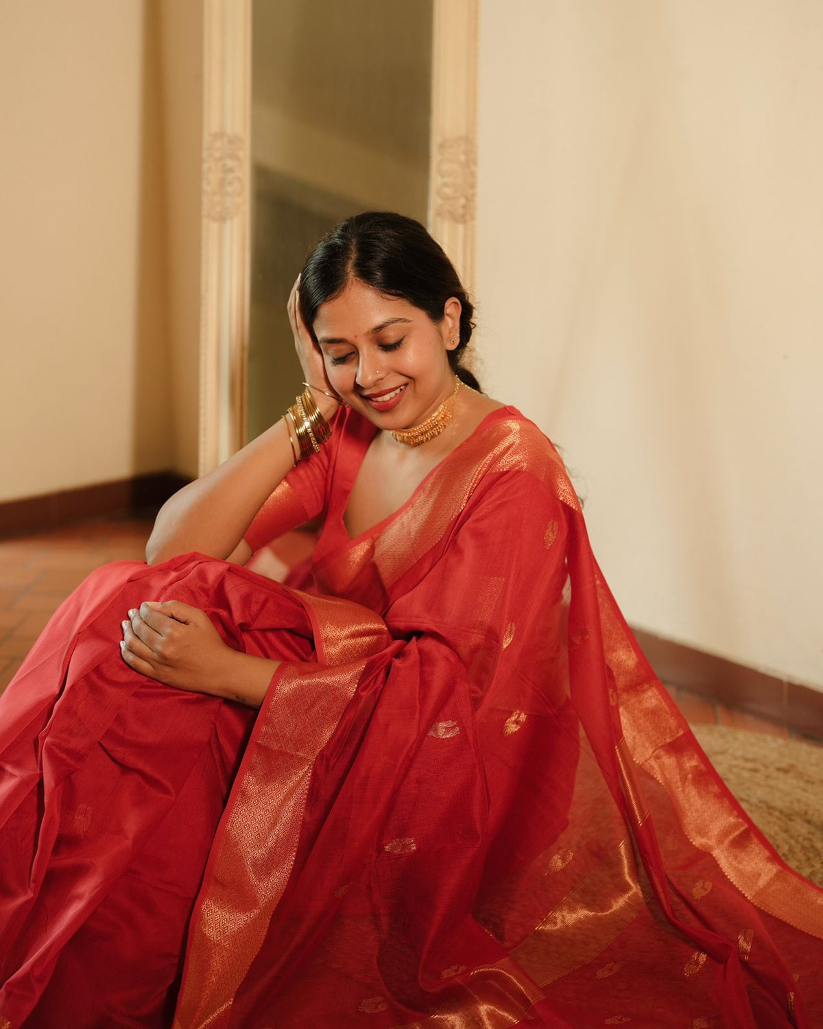 Red Maheshwari saree with morni motifs all over