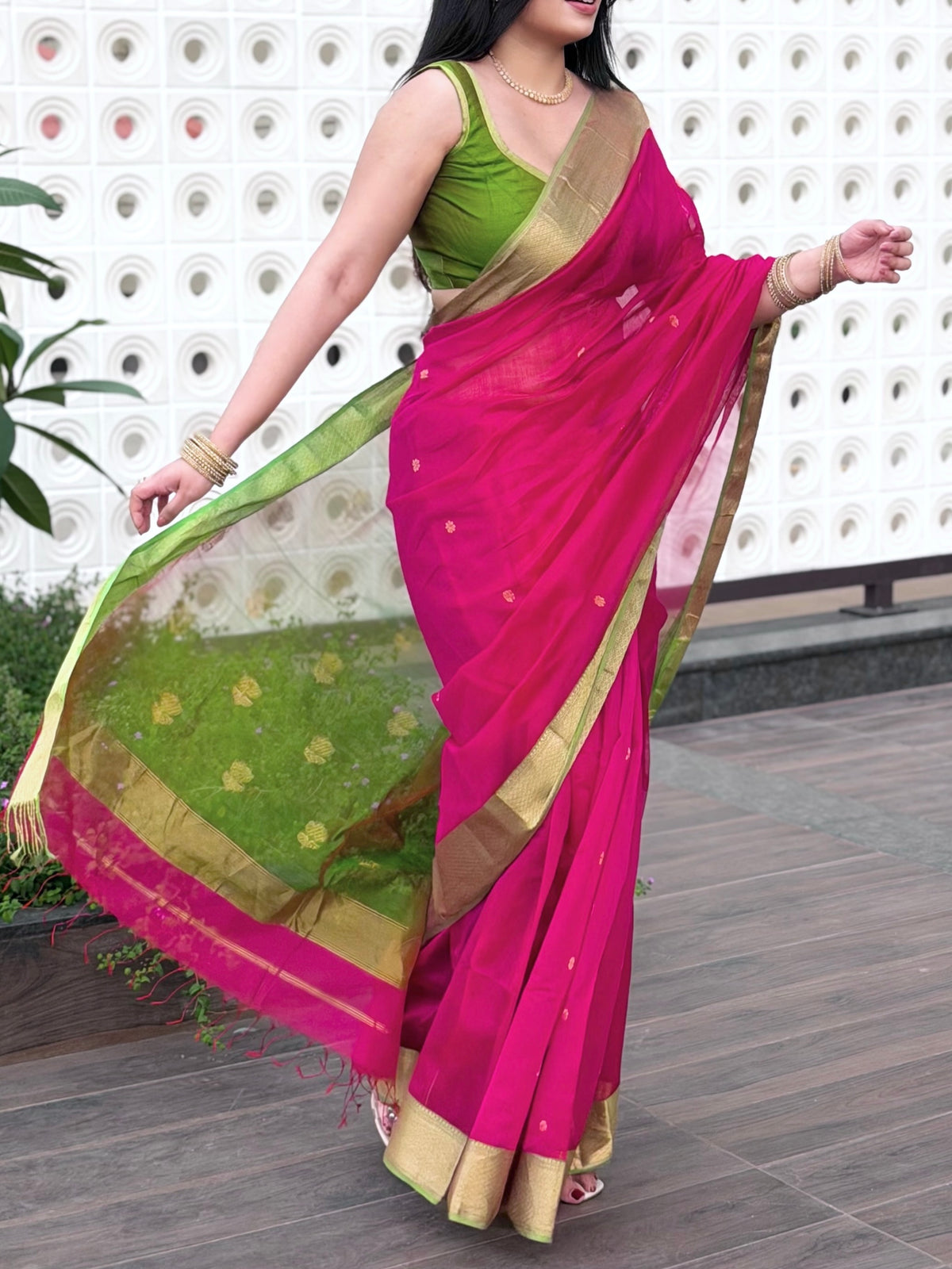 Pink and olive green Maheshwari saree with flower motifs on pallu