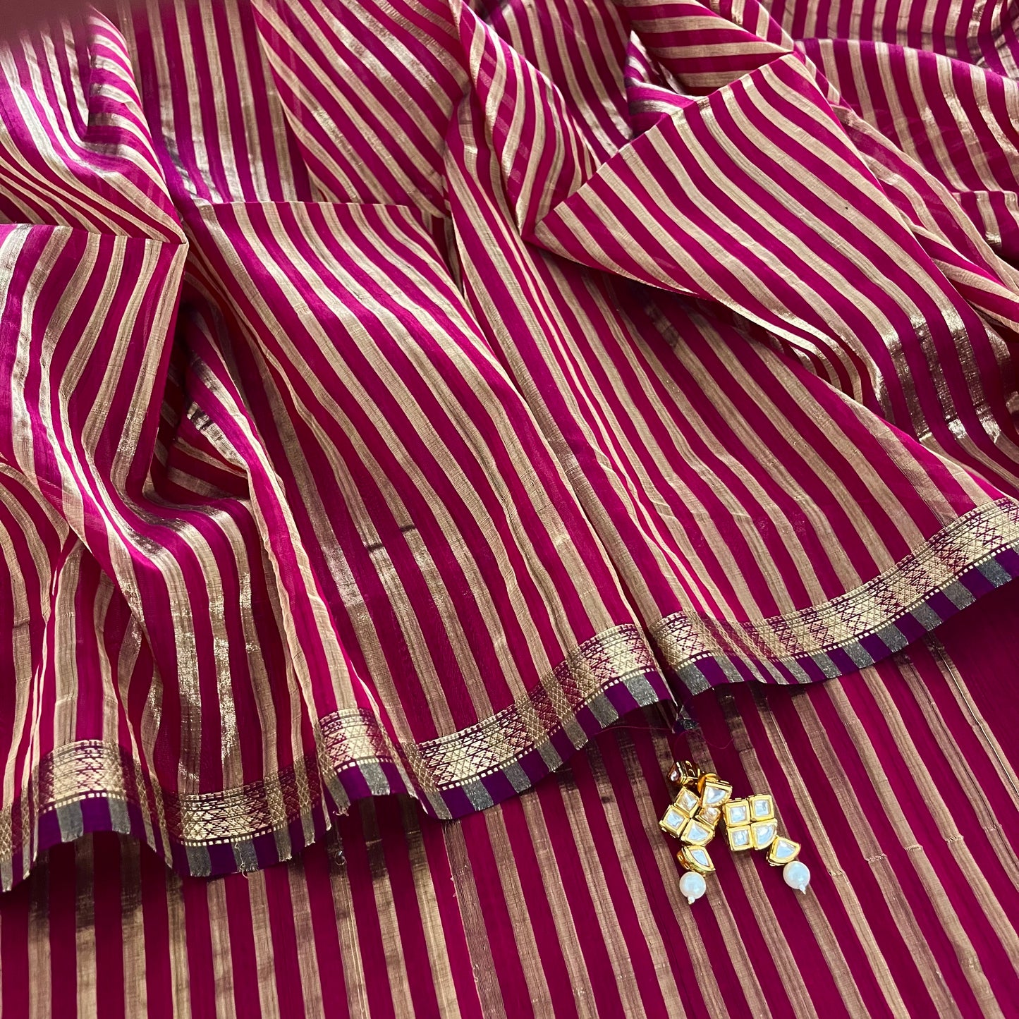 Dark pink Maheshwari saree with zari stripes all over