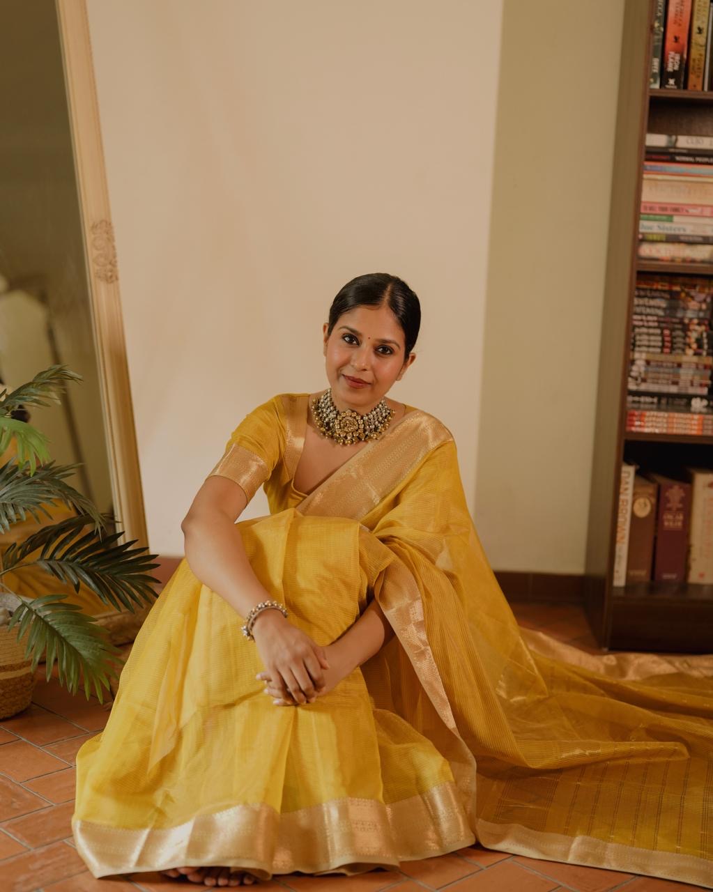 Yellow Maheshwari saree with zari lines all over