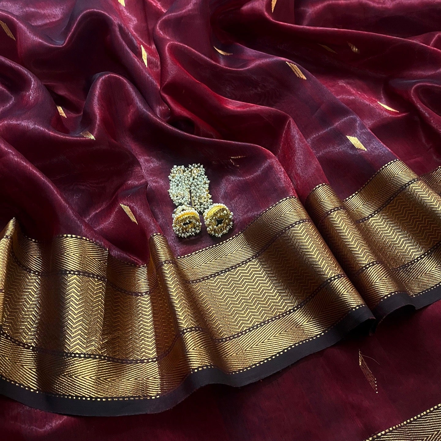 Mahogany Maheshwari tissue silk saree with zari bootis all over