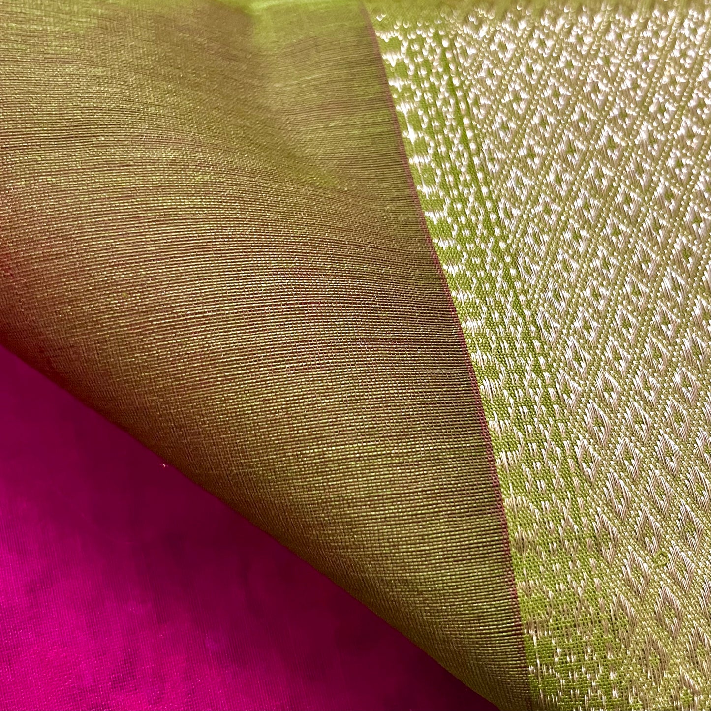 Pink and olive green Maheshwari saree with flower motifs on pallu