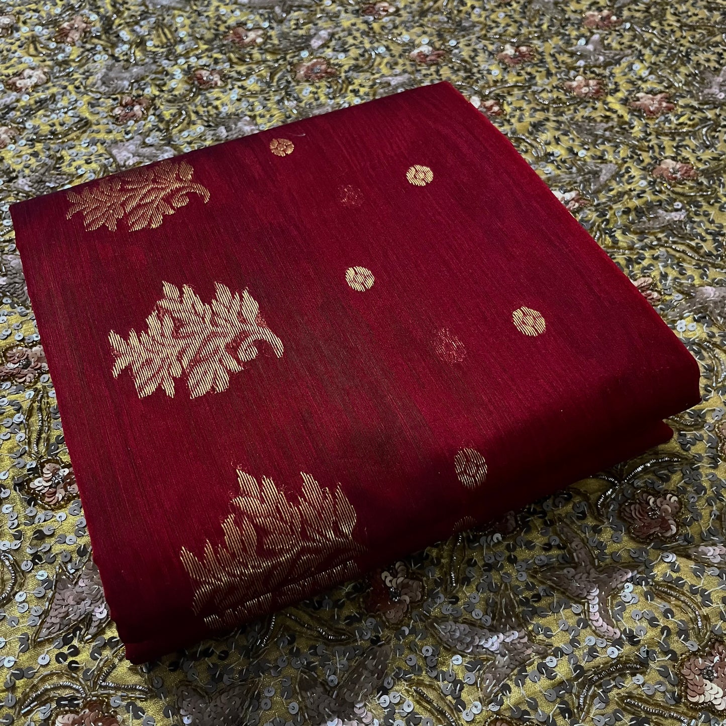 Deep maroon Chanderi saree with zari bootis all over and flower motifs on pallu