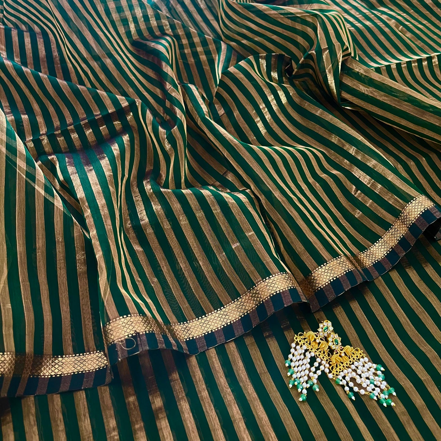 Dark green Maheshwari saree with zari stripes all over