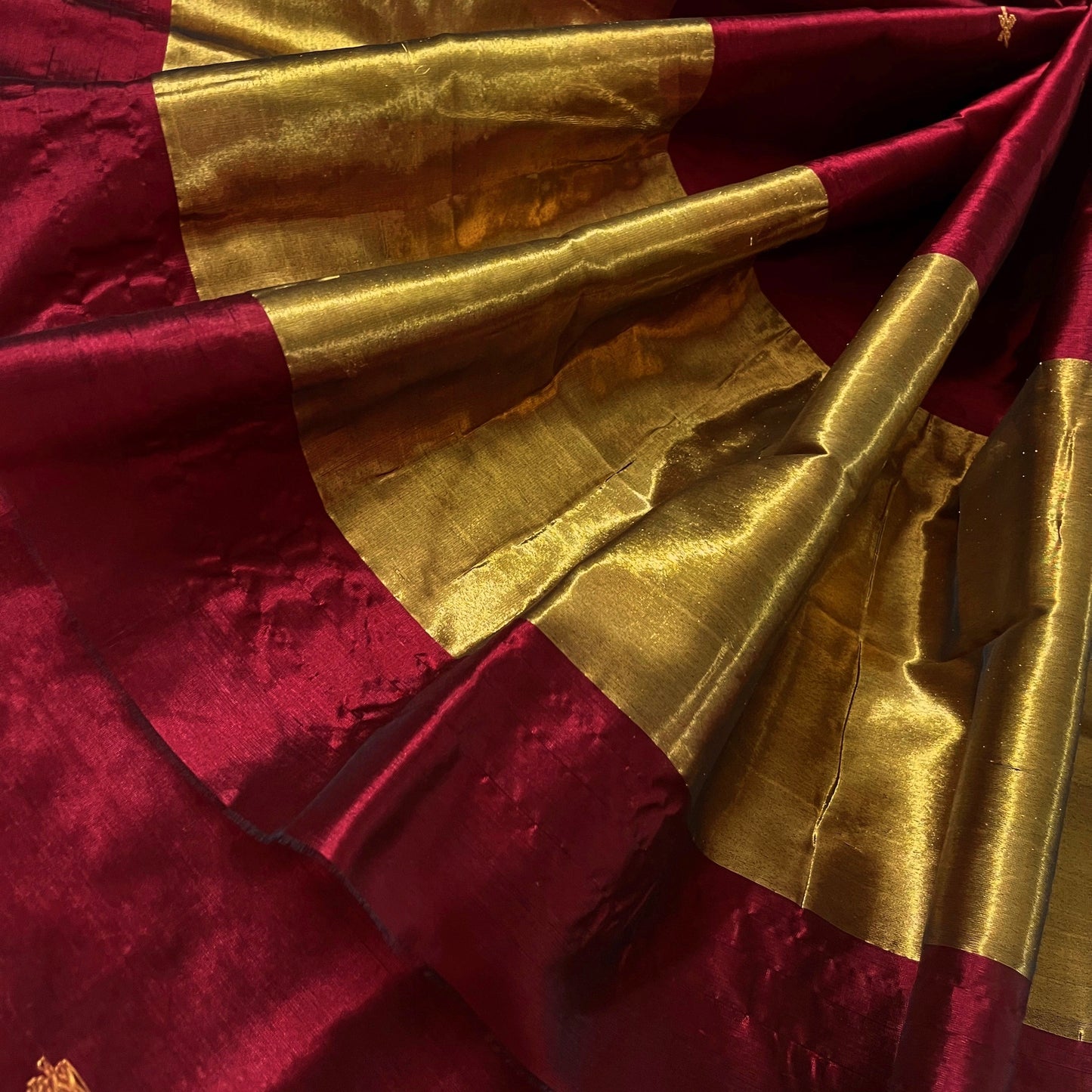 Deep maroon chanderi silk saree with flower bootis all over