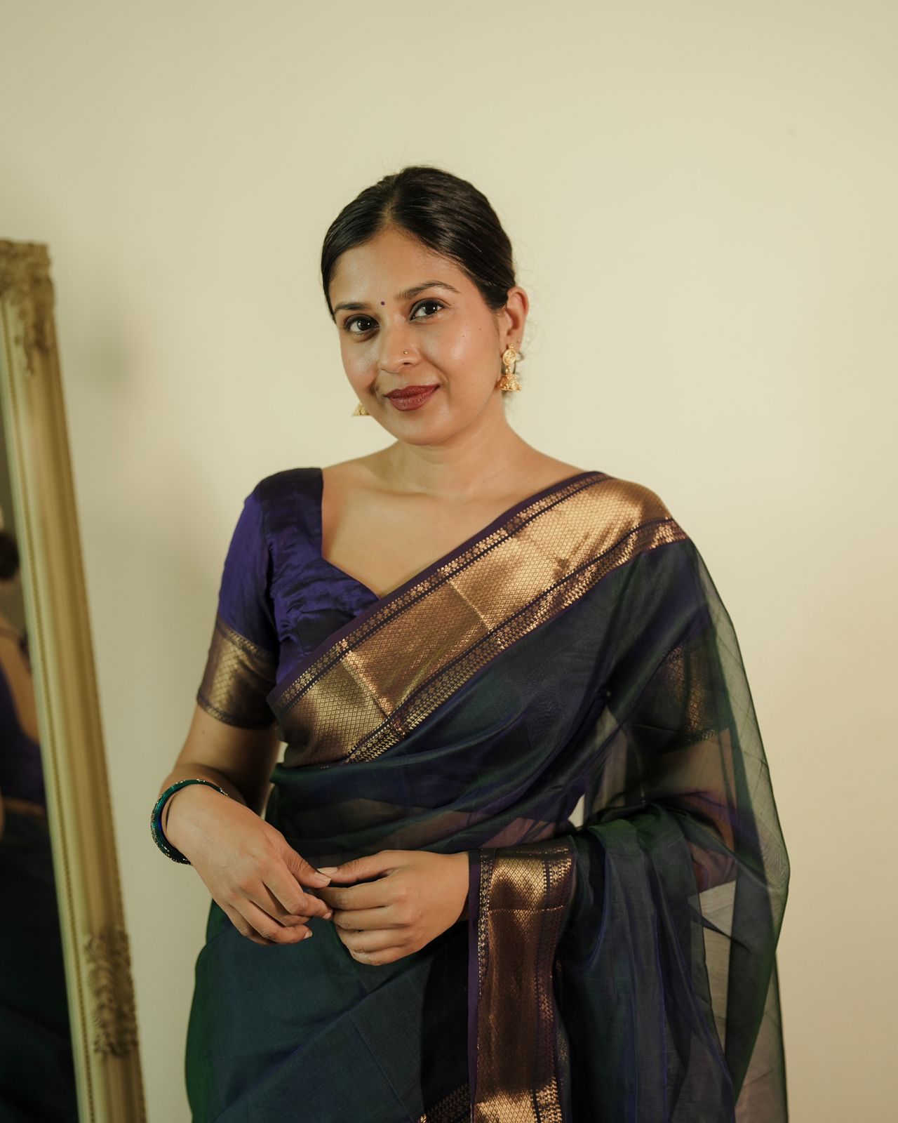 Peacock and purple dual tone Maheshwari saree with flower motifs on pallu