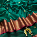 Dark green and red Maheshwari saree with flower motifs all over