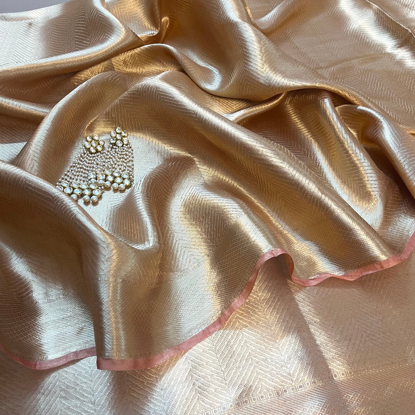 Champagne gold Banarasi silk saree with zari pattern all over