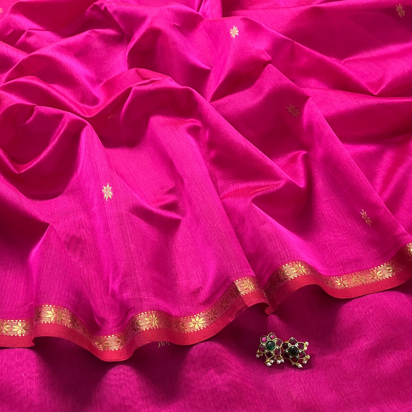 Pink Maheshwari saree with flower bootis all over