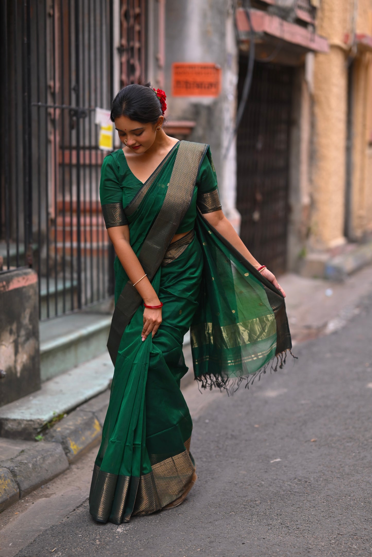 Dark green maheshwari with saree with flower bootis all over