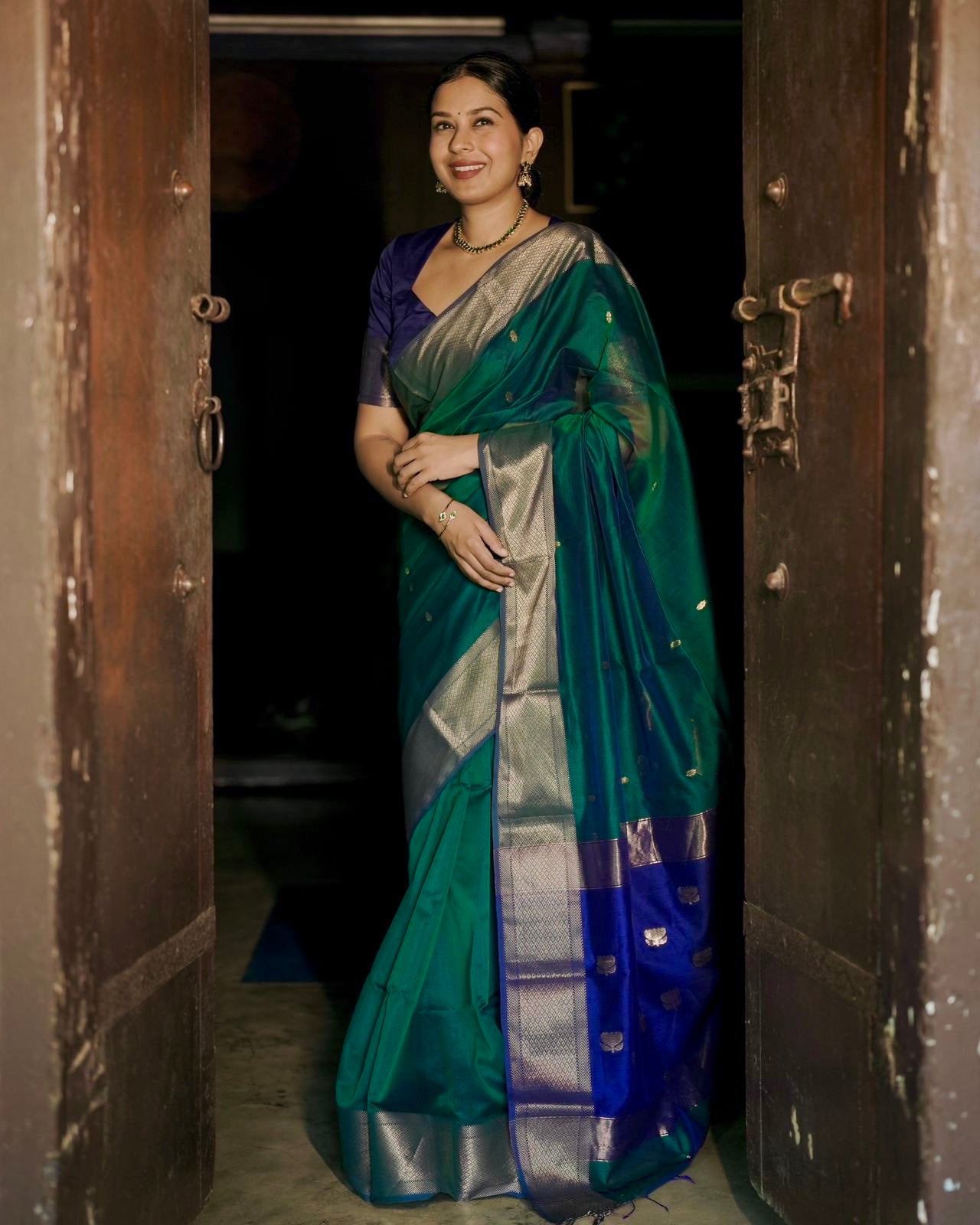 Dark Green and blue maheshwari dual tone saree with flower bootis all over