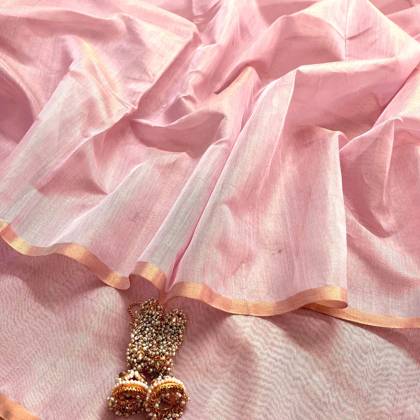 Light pink maheshwari tissue silk saree with zari lines on pallu