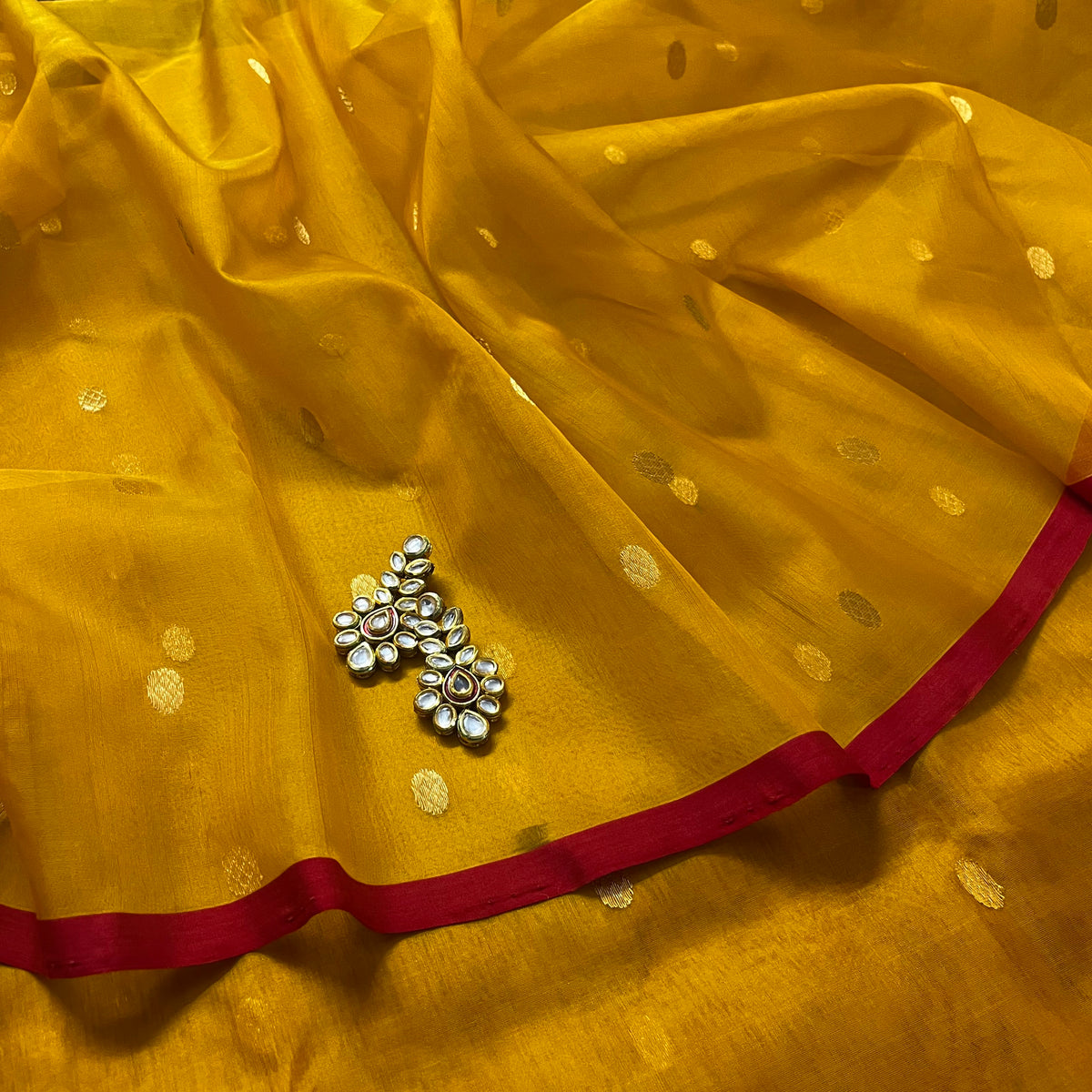 Mustard red Chanderi silk saree with zari bootis all over