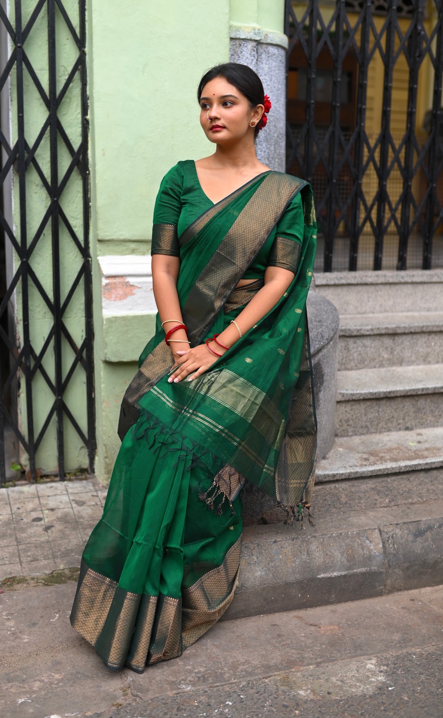 Dark green maheshwari with saree with flower bootis all over