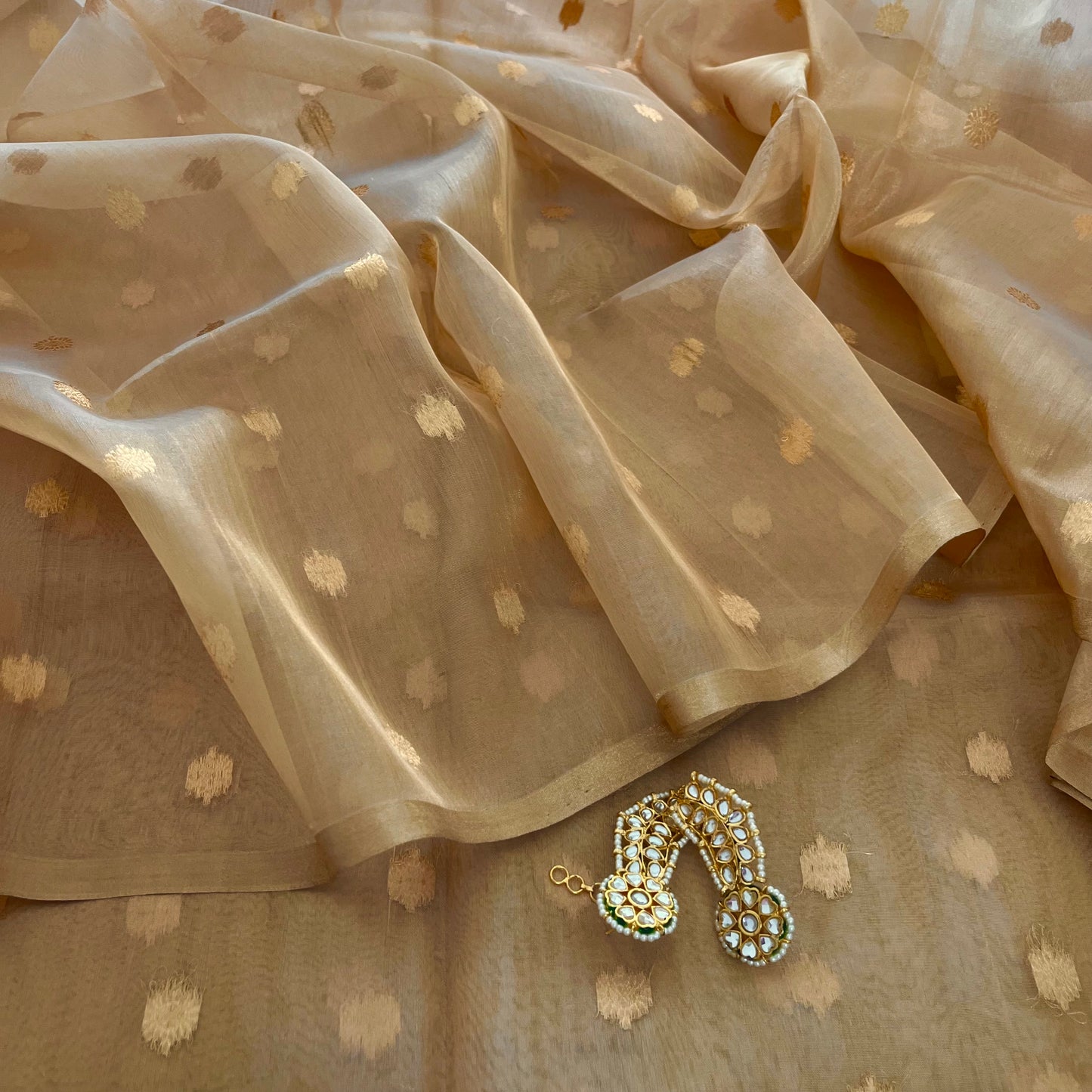 Gold Banarasi tissue silk saree with flower bootis all over