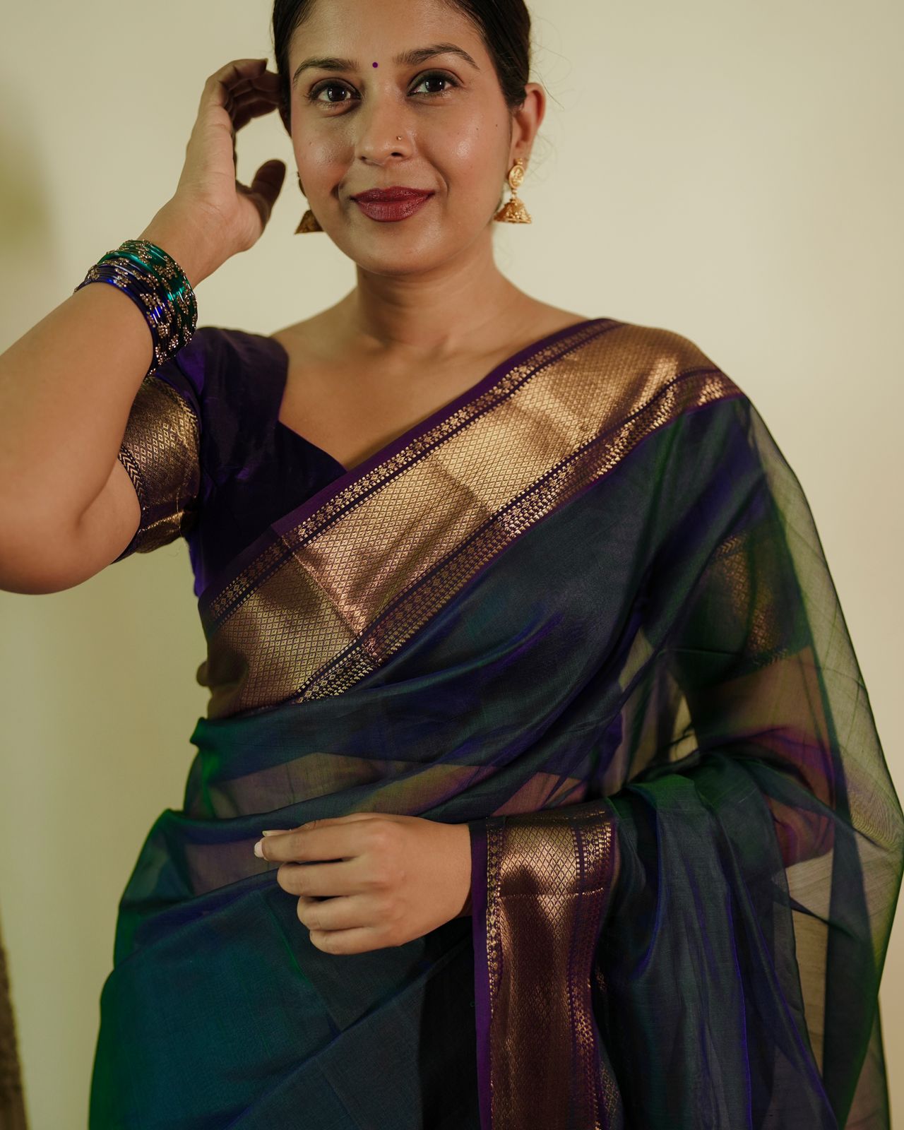 Peacock and purple dual tone Maheshwari saree with flower motifs on pallu