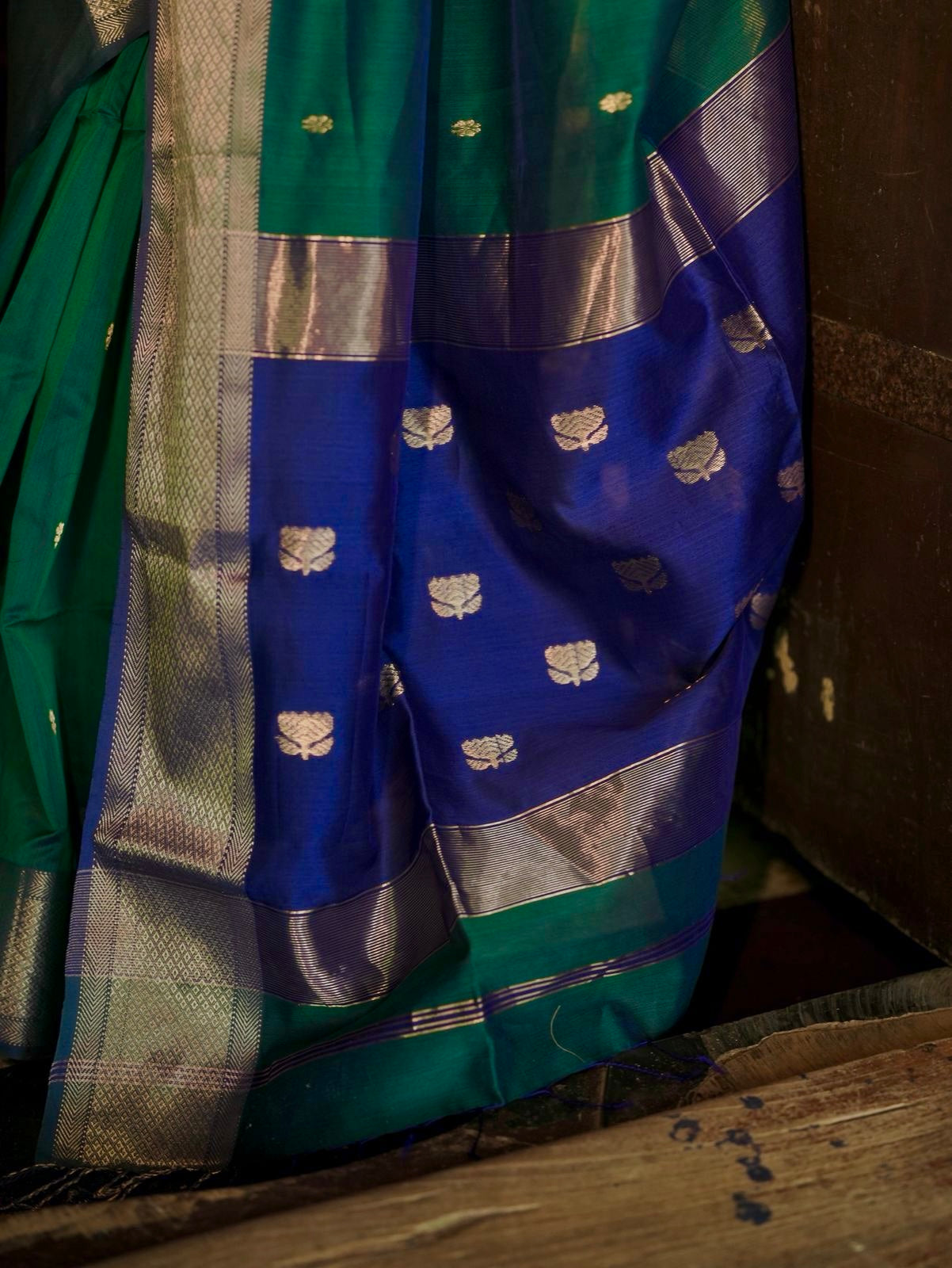 Dark Green and blue maheshwari dual tone saree with flower bootis all over