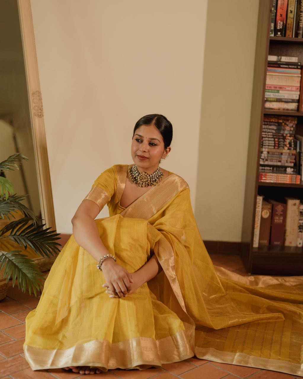 Yellow Maheshwari saree with zari lines all over
