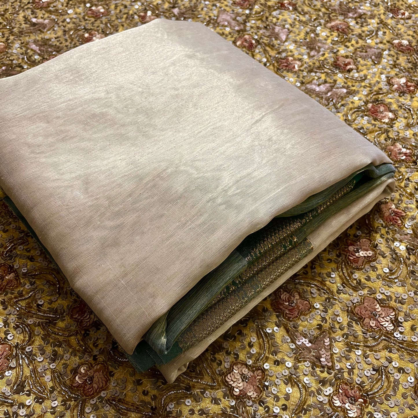 Gold and green Maheshwari tissue silk saree with zari pattern on pallu