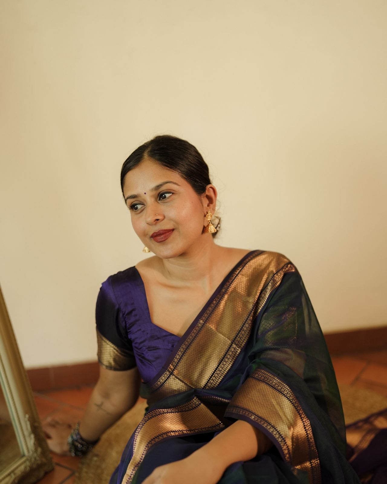 Peacock and purple dual tone Maheshwari saree with flower motifs on pallu