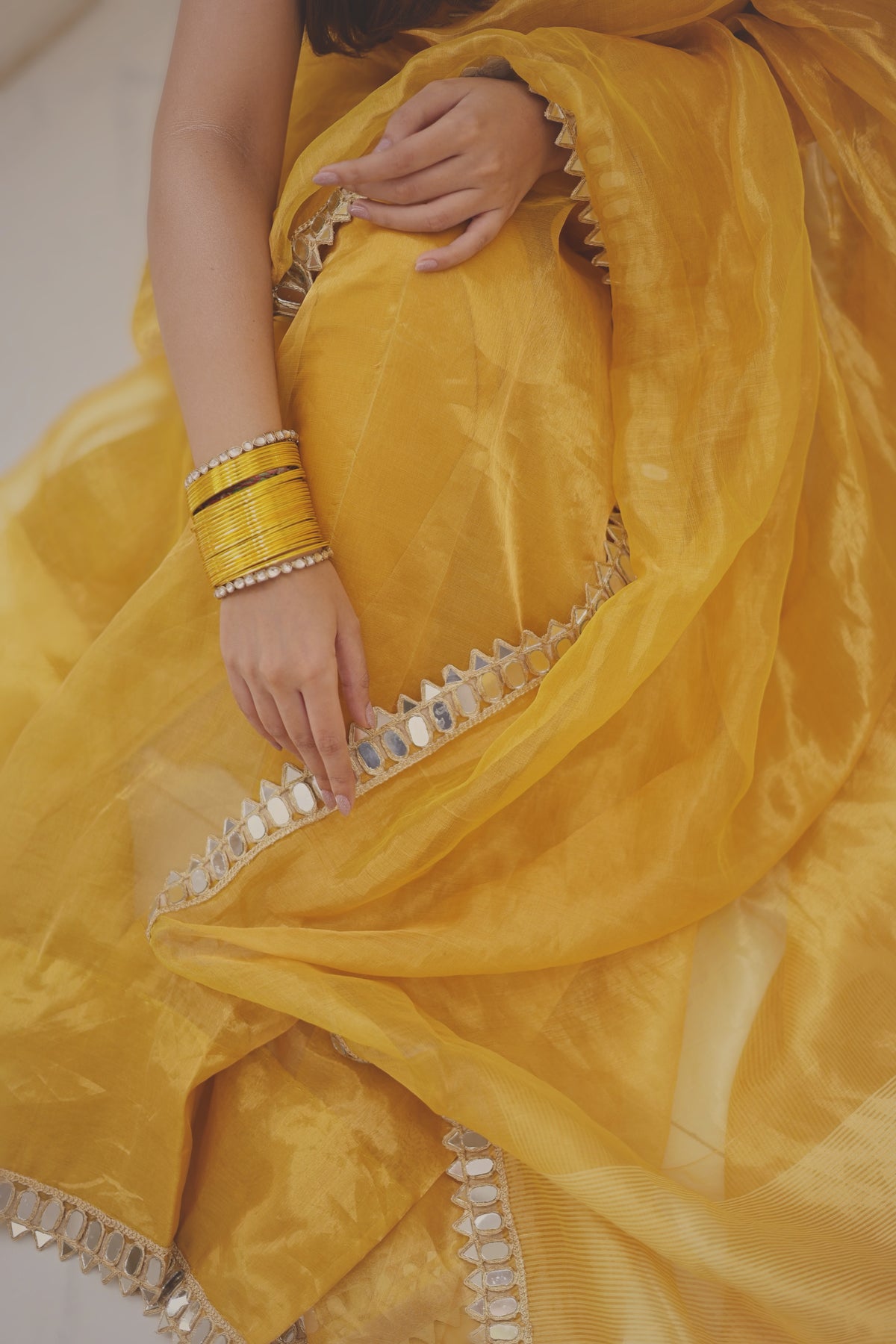Molten amber gold chanderi tissue silk saree with mirror work border