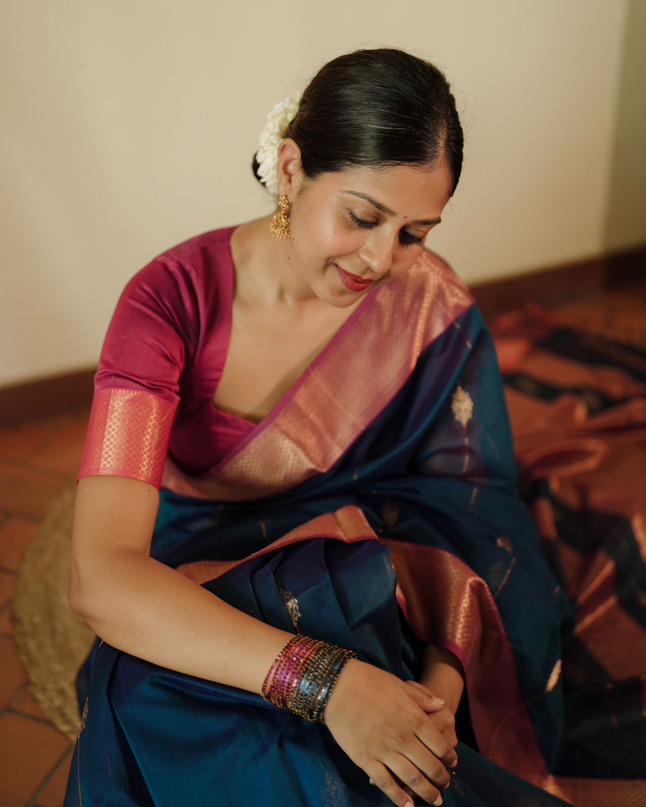 Peacock blue and pink Maheshwari saree with zari motifs all over