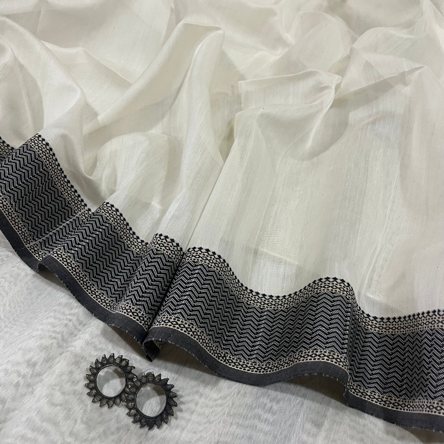 White and Black Maheshwari saree with resham border and Threadwork on pallu