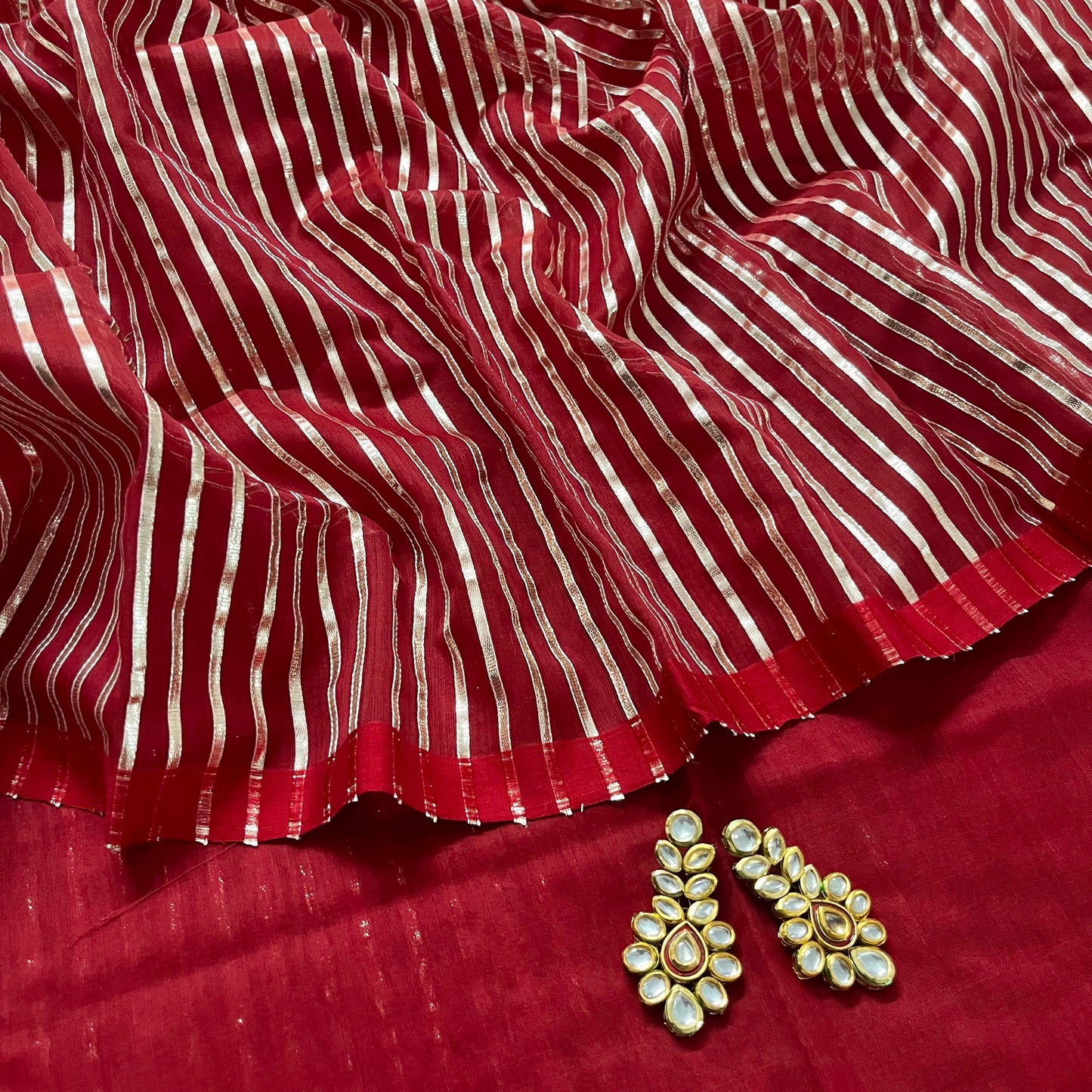 Deep red chanderi saree with intricate gota work all over