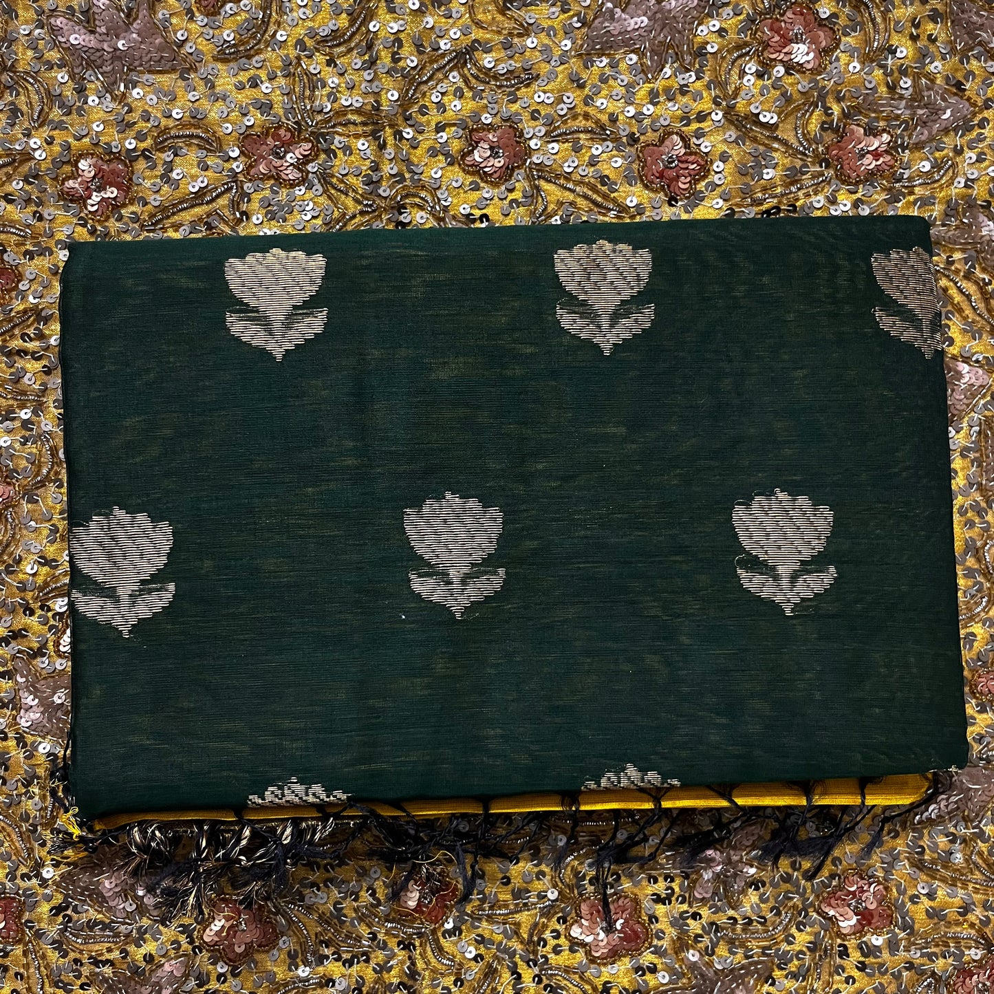 Mustard and green Maheshwari saree with flower motifs on pallu