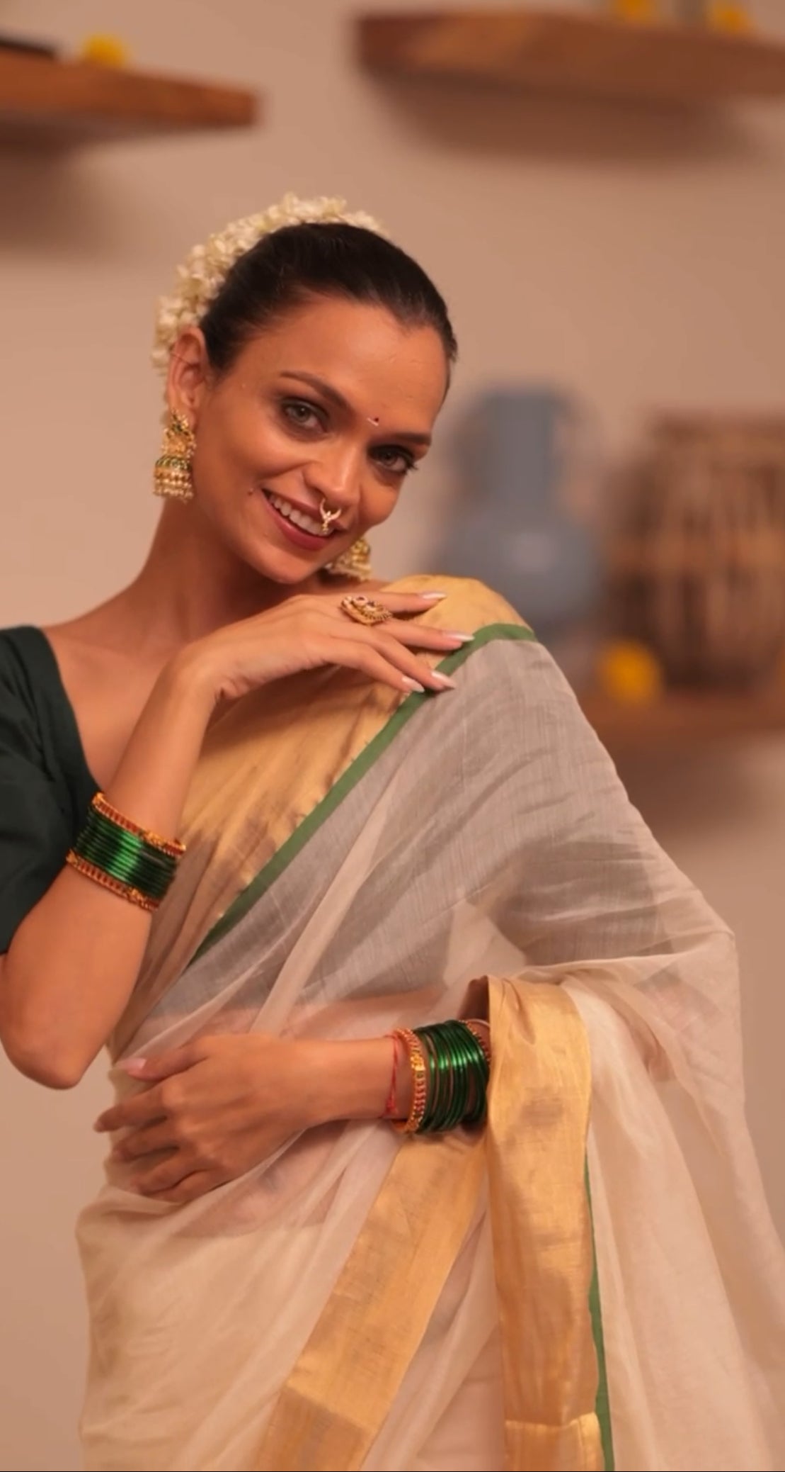 Off white and green maheshwari saree with zari lines on pallu