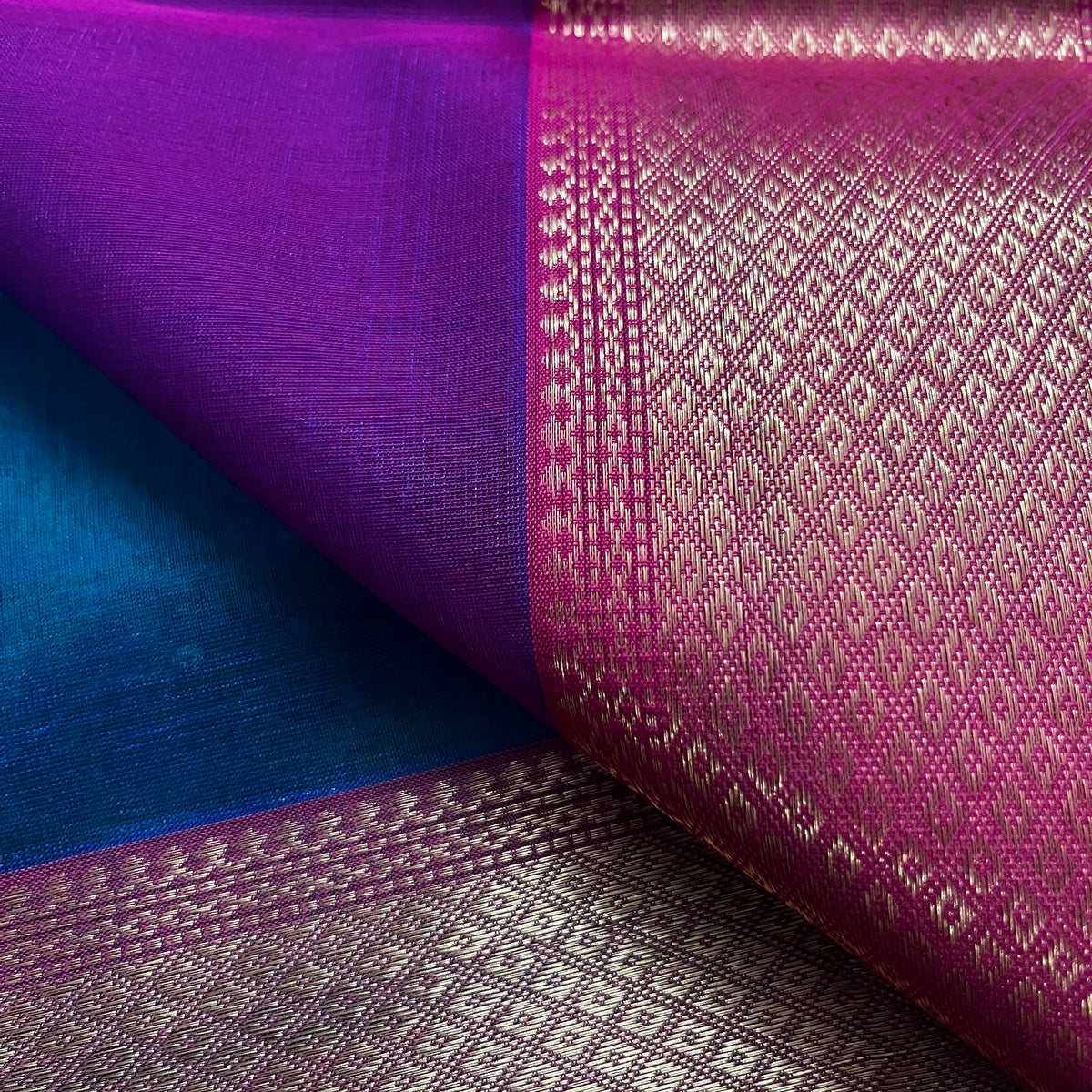 Peacock and Violet dual tone Maheshwari saree with flower motifs on pallu