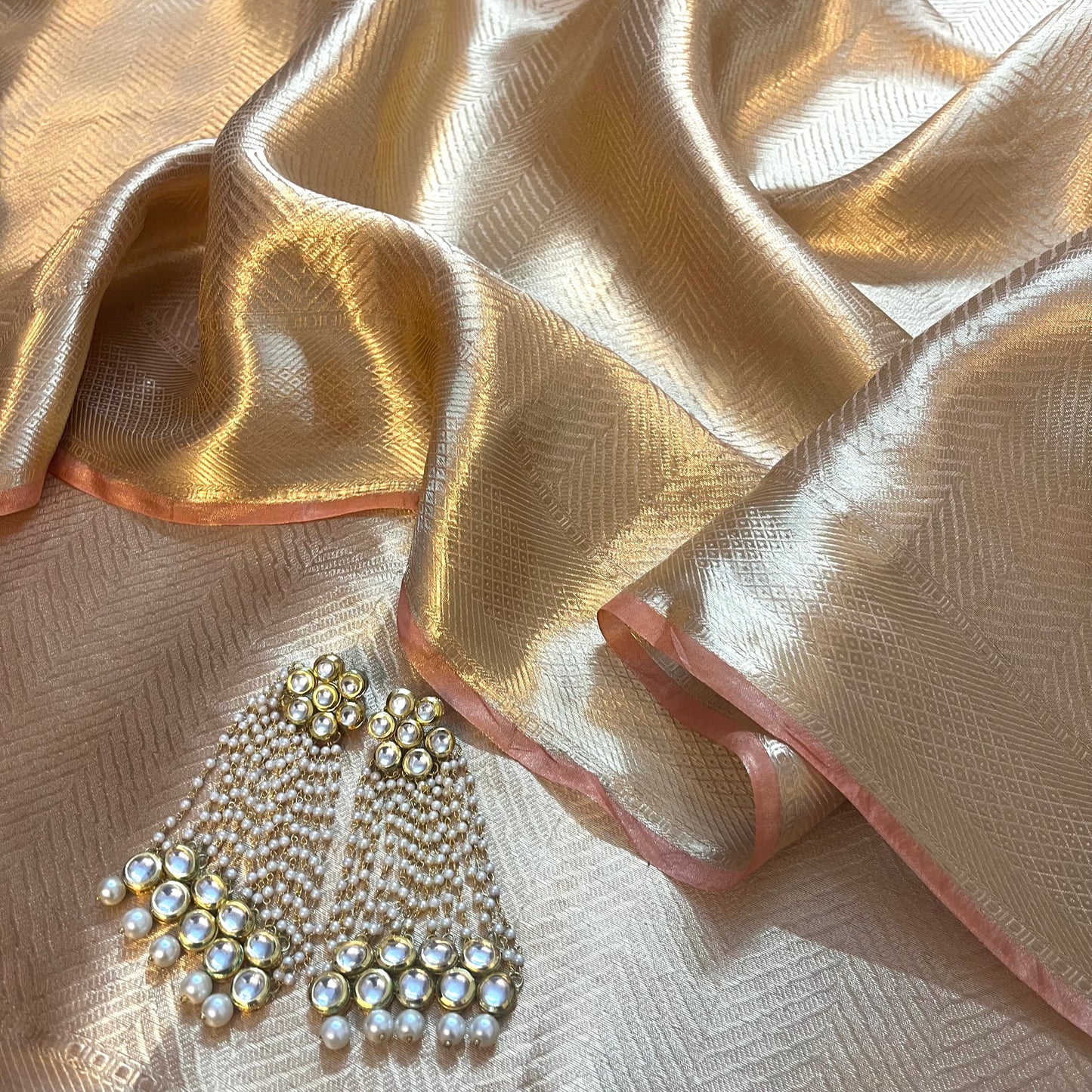Champagne gold Banarasi silk saree with zari pattern all over