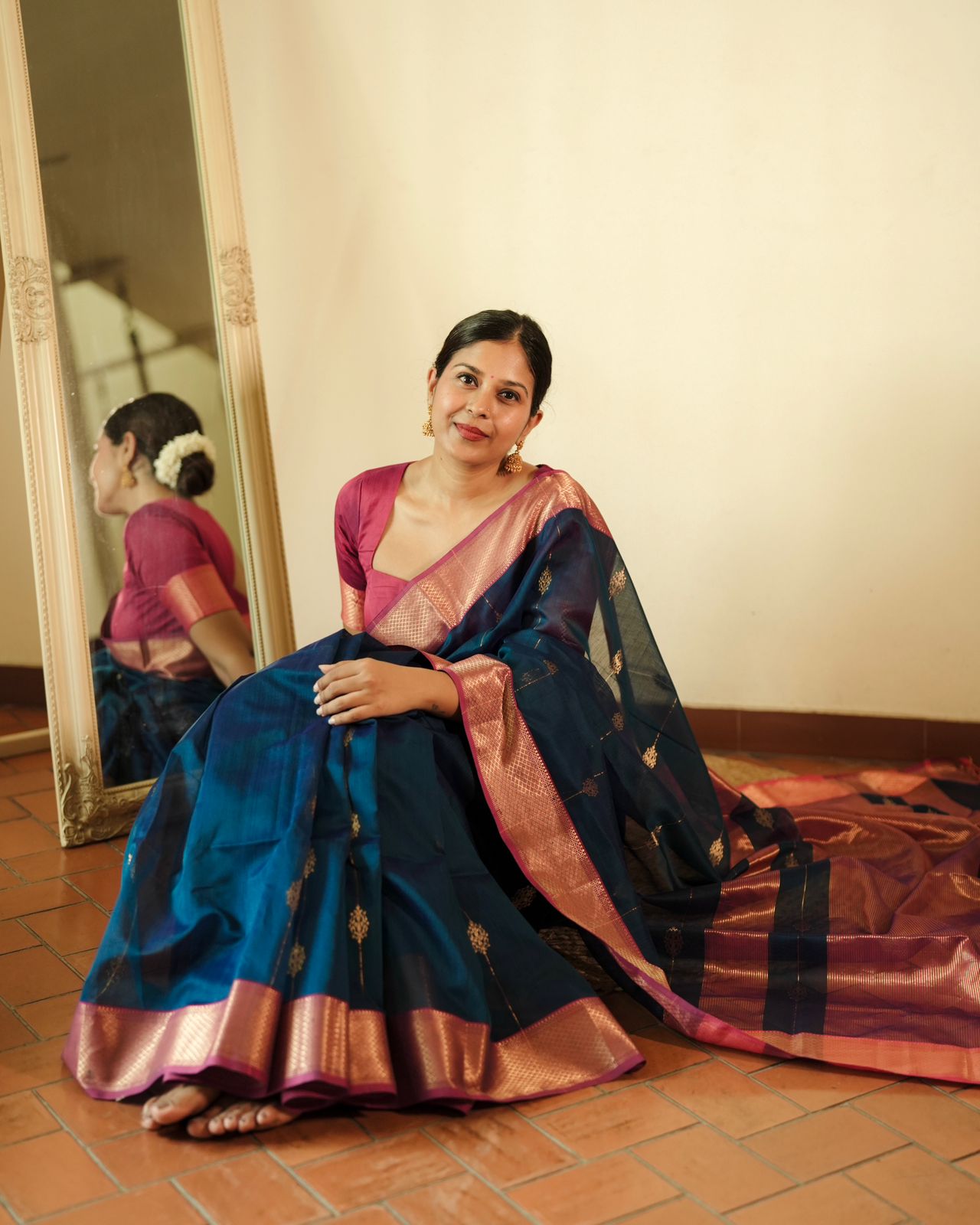 Peacock blue and pink Maheshwari saree with zari motifs all over