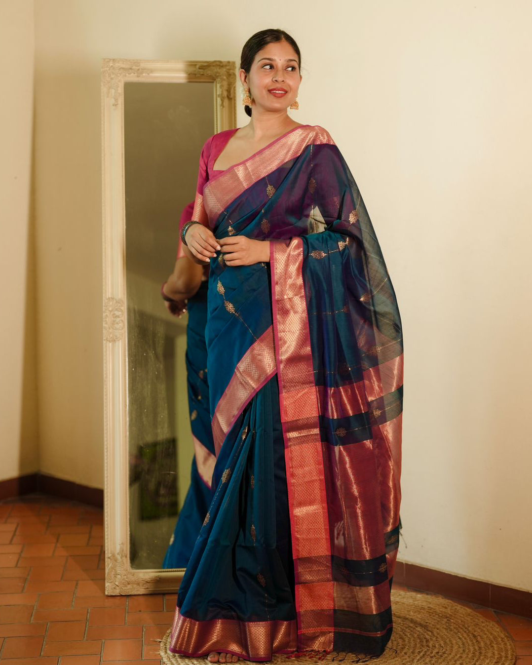 Peacock blue and pink Maheshwari saree with zari motifs all over