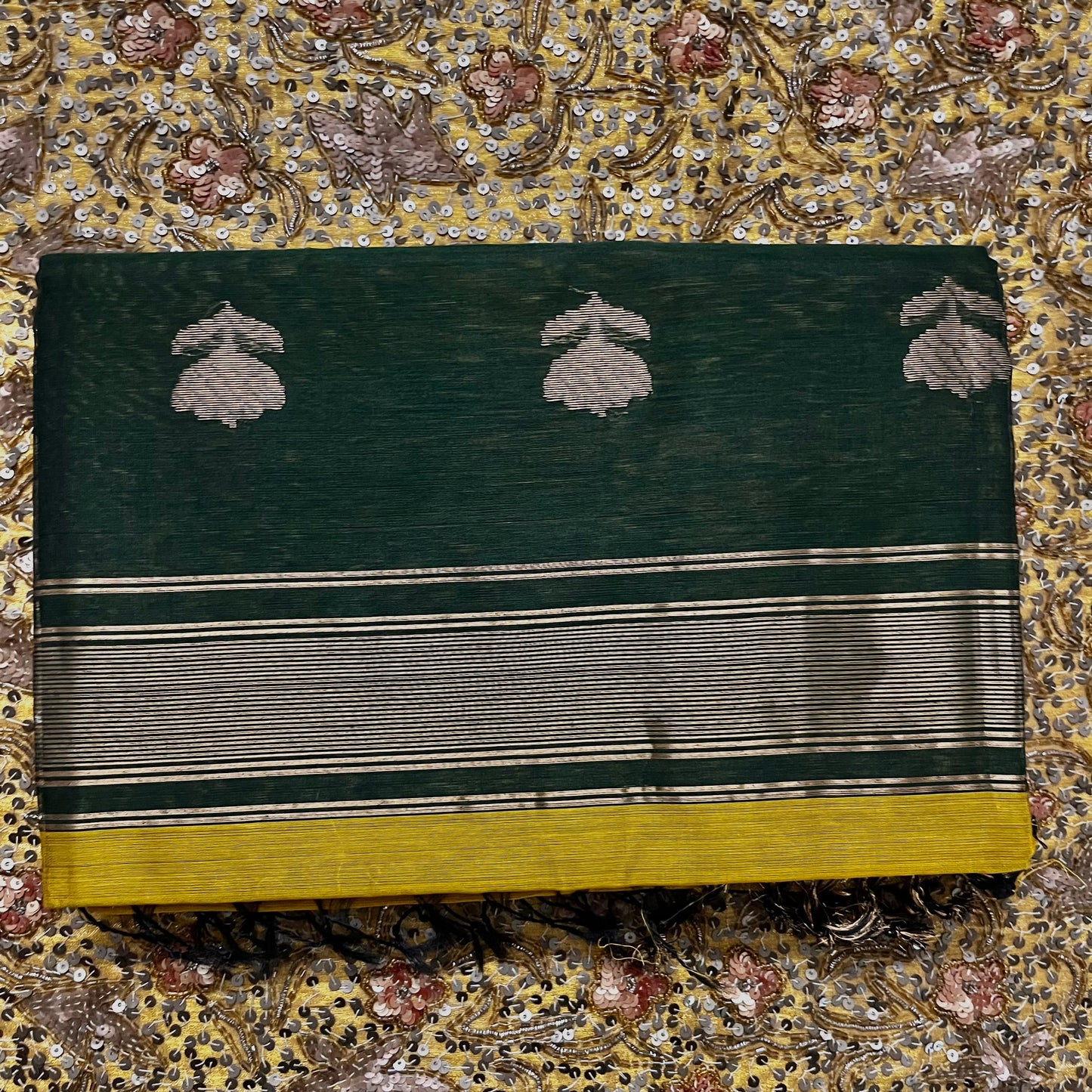 Mustard and green Maheshwari saree with flower motifs on pallu