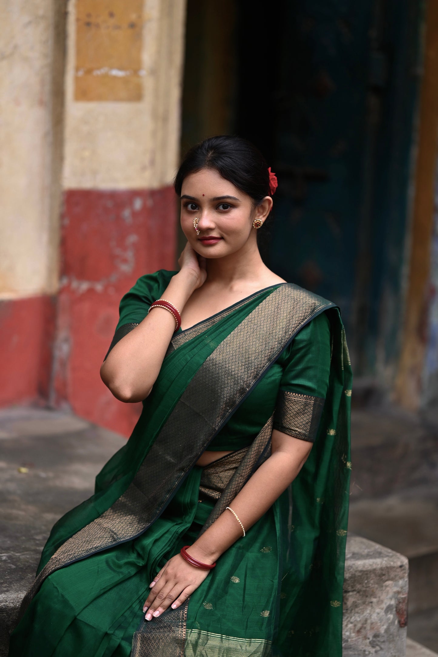 Dark green maheshwari with saree with flower bootis all over