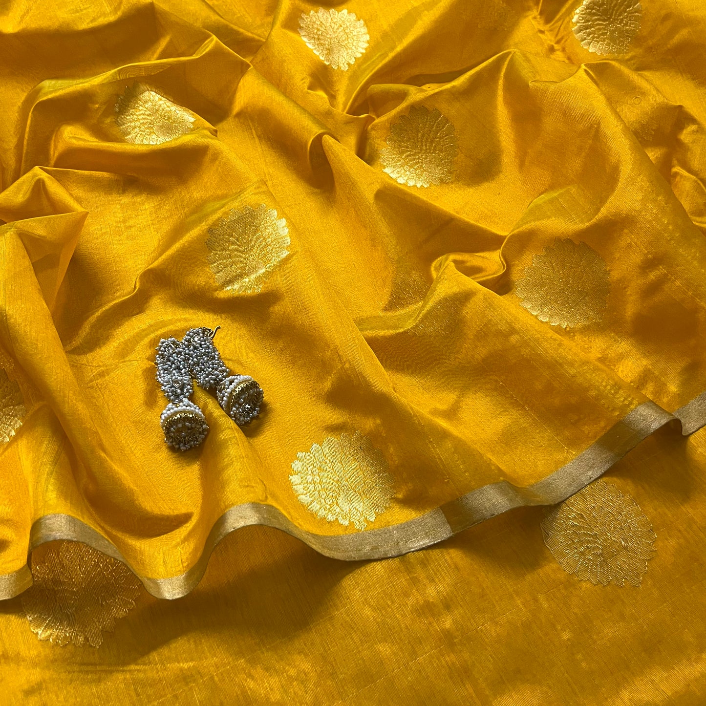 Yellow chanderi silk saree with mor motifs all over