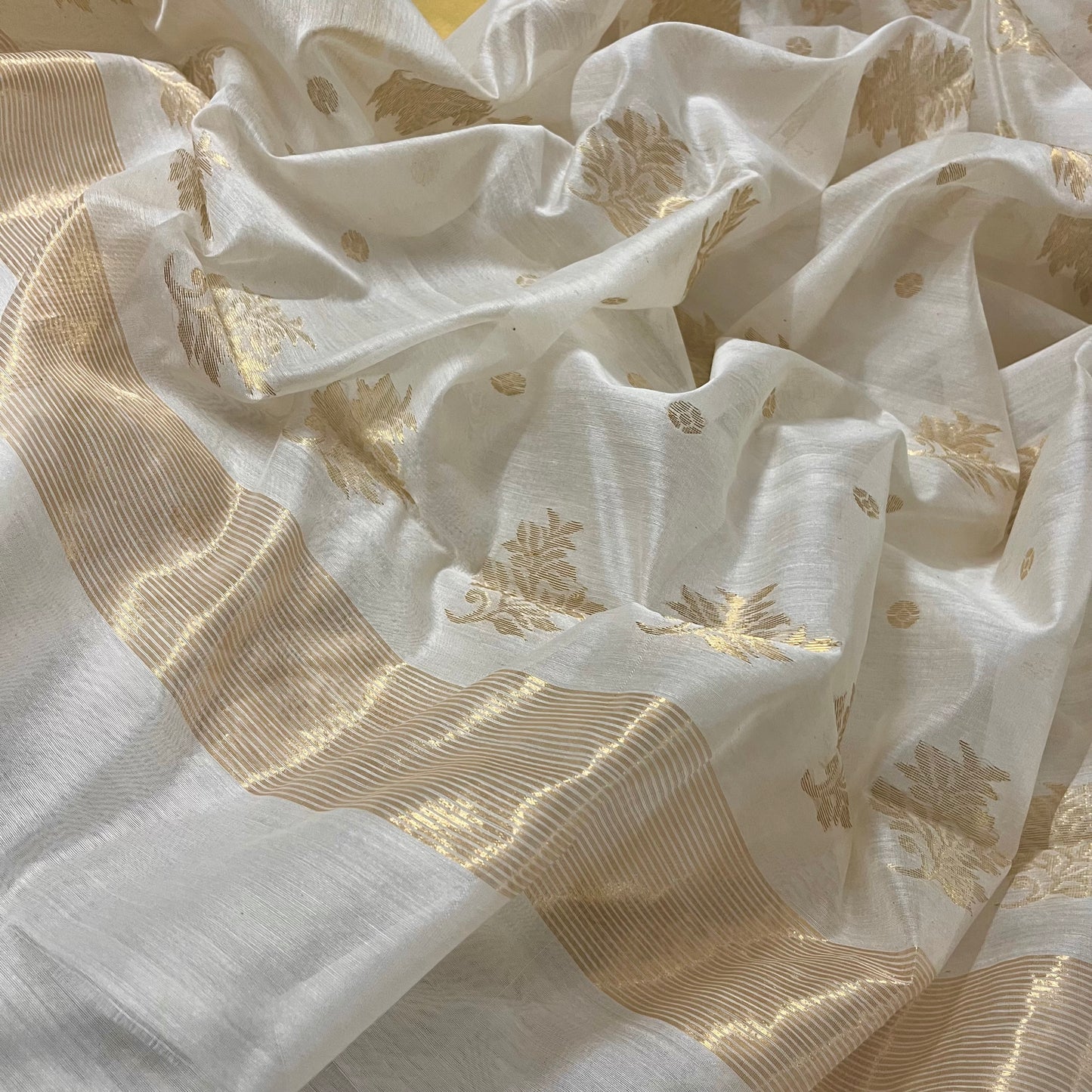 Off white Chanderi saree with zari bootis all over and zari motifs on pallu