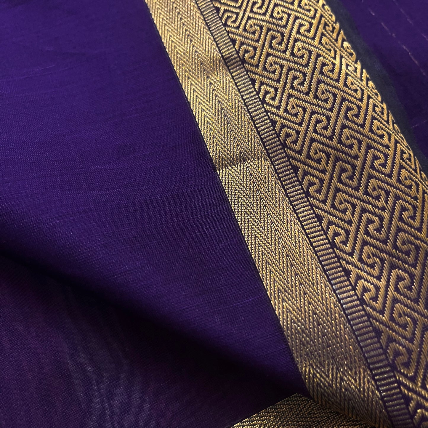 Dark purple Maheshwari saree with dori flower bootis all over