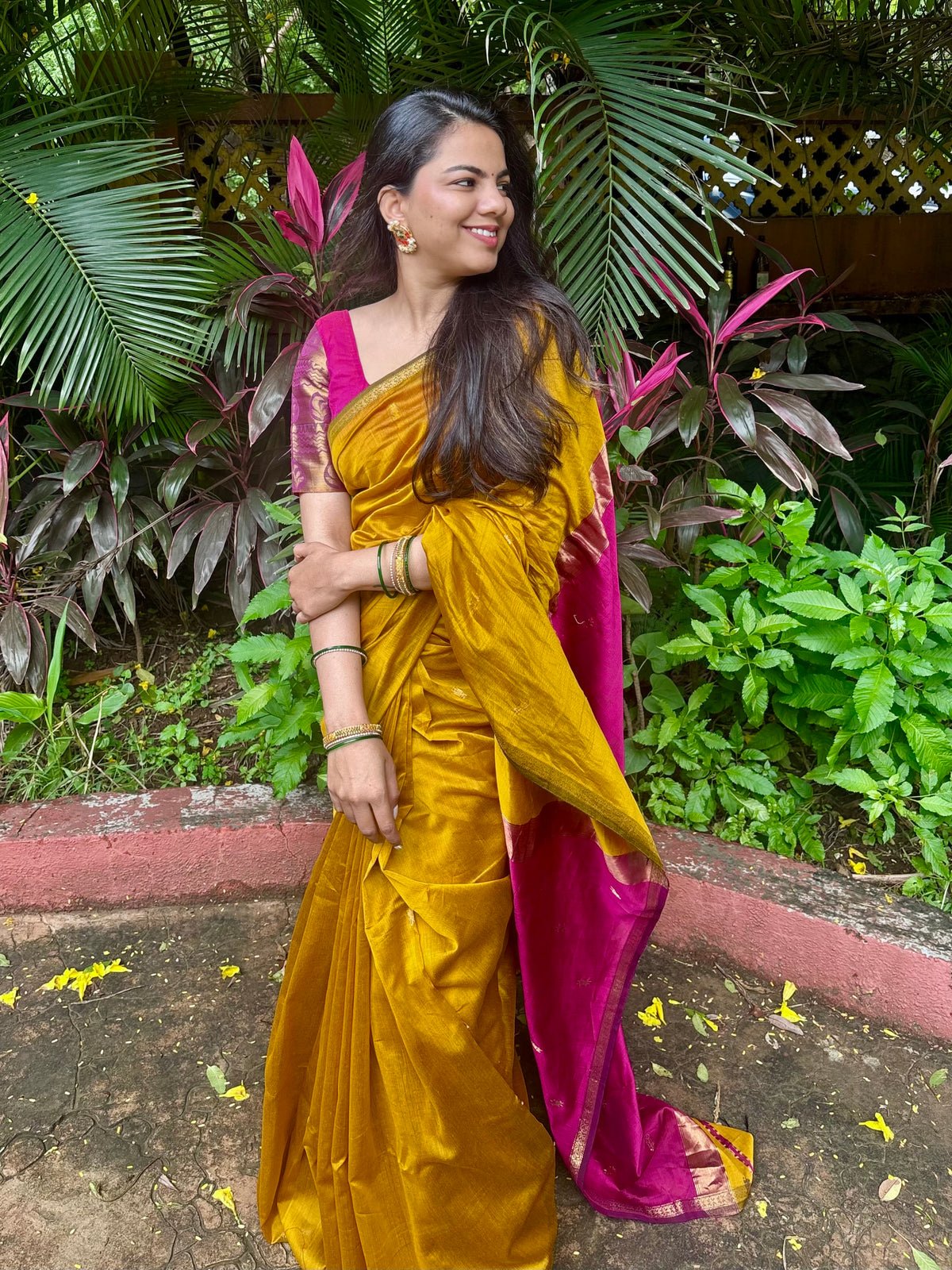 Mustard and pink maheshwari saree with flower bootis all over