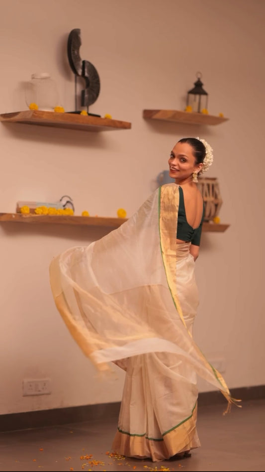 Off white and green maheshwari saree with zari lines on pallu
