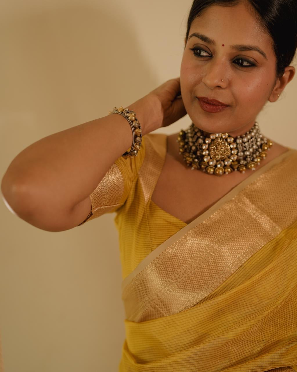 Yellow Maheshwari saree with zari lines all over
