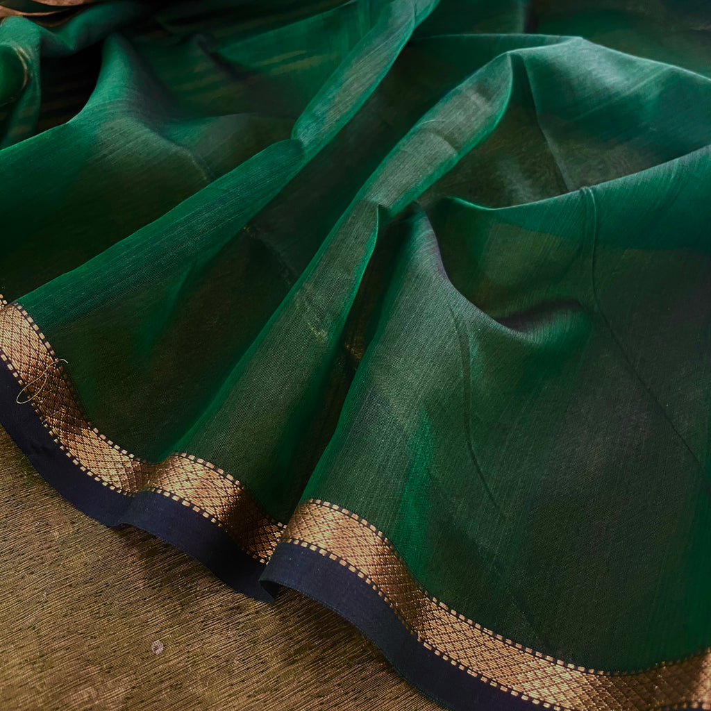 Dark green Maheshwari saree with zari stripes all over